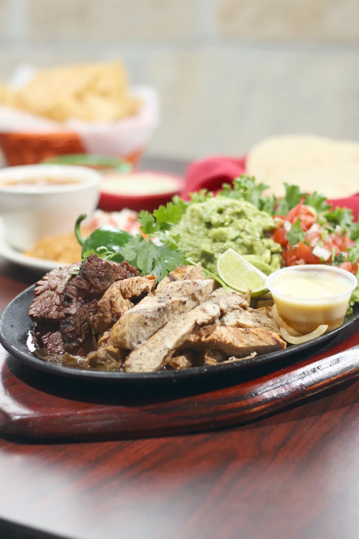 Sizzling fajitas with grilled meats and fresh toppings