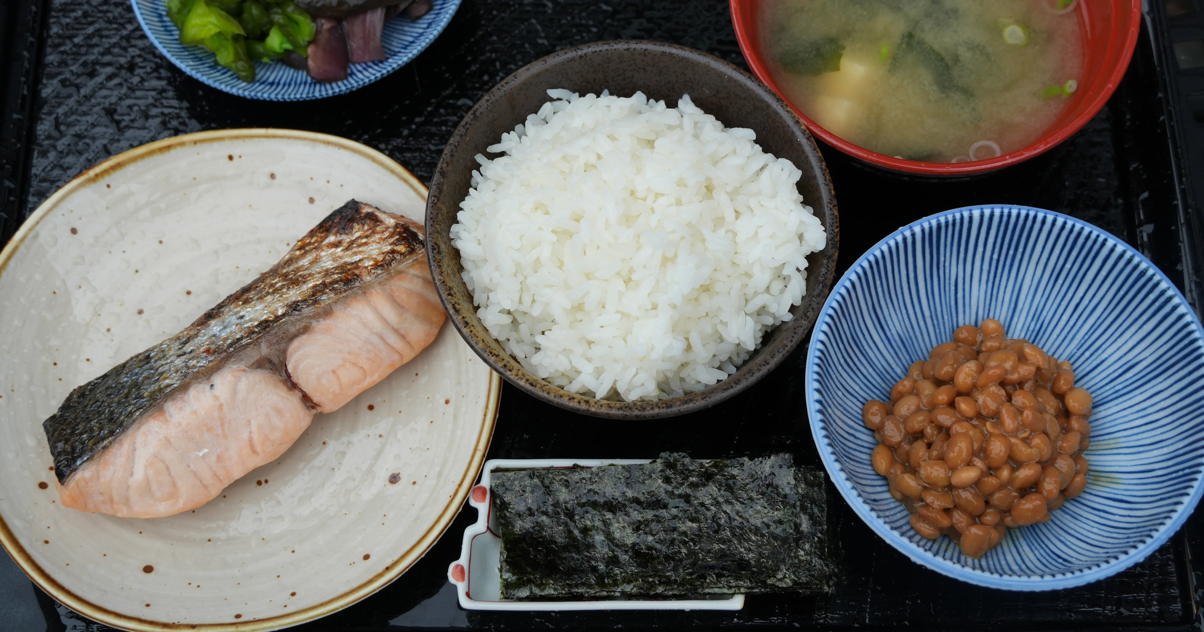 Traditional Japanese breakfast with grilled salmon and miso soup