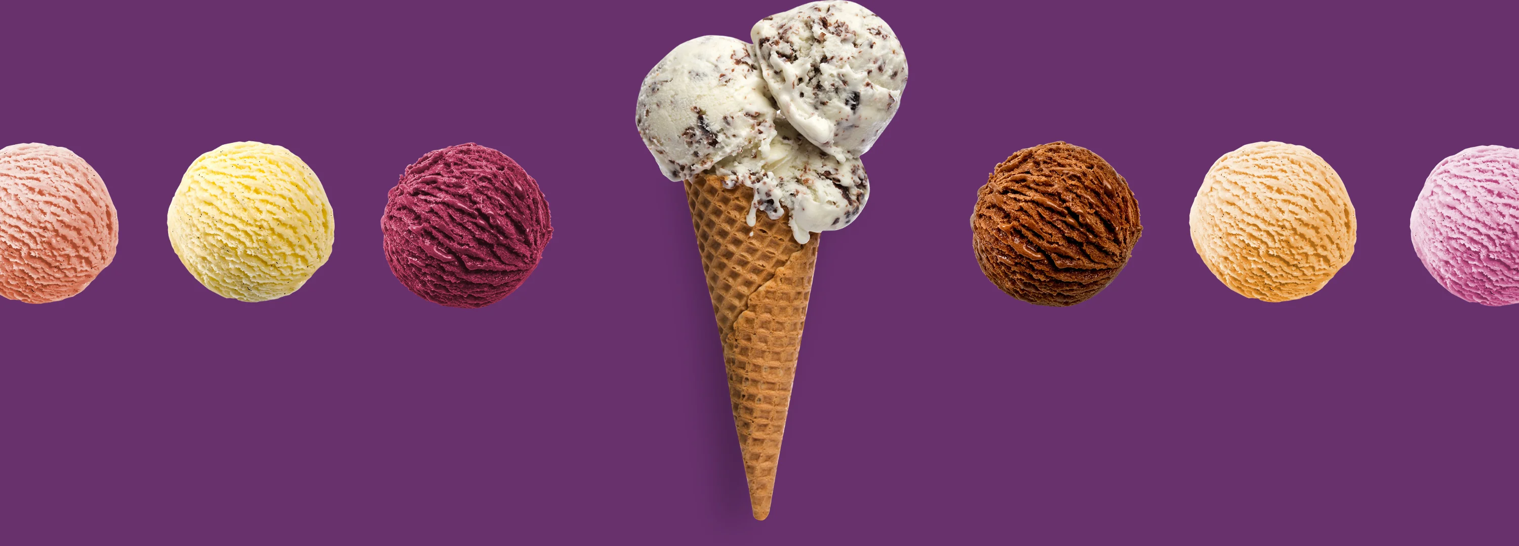 Three ice cream cones held by friends on a sunny street