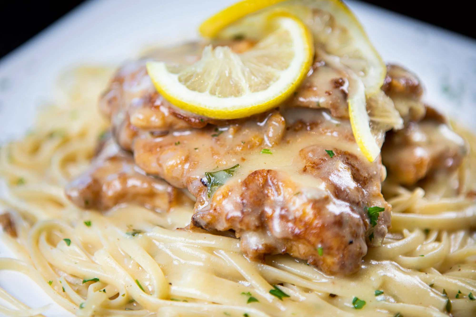 Creamy chicken piccata served over linguine