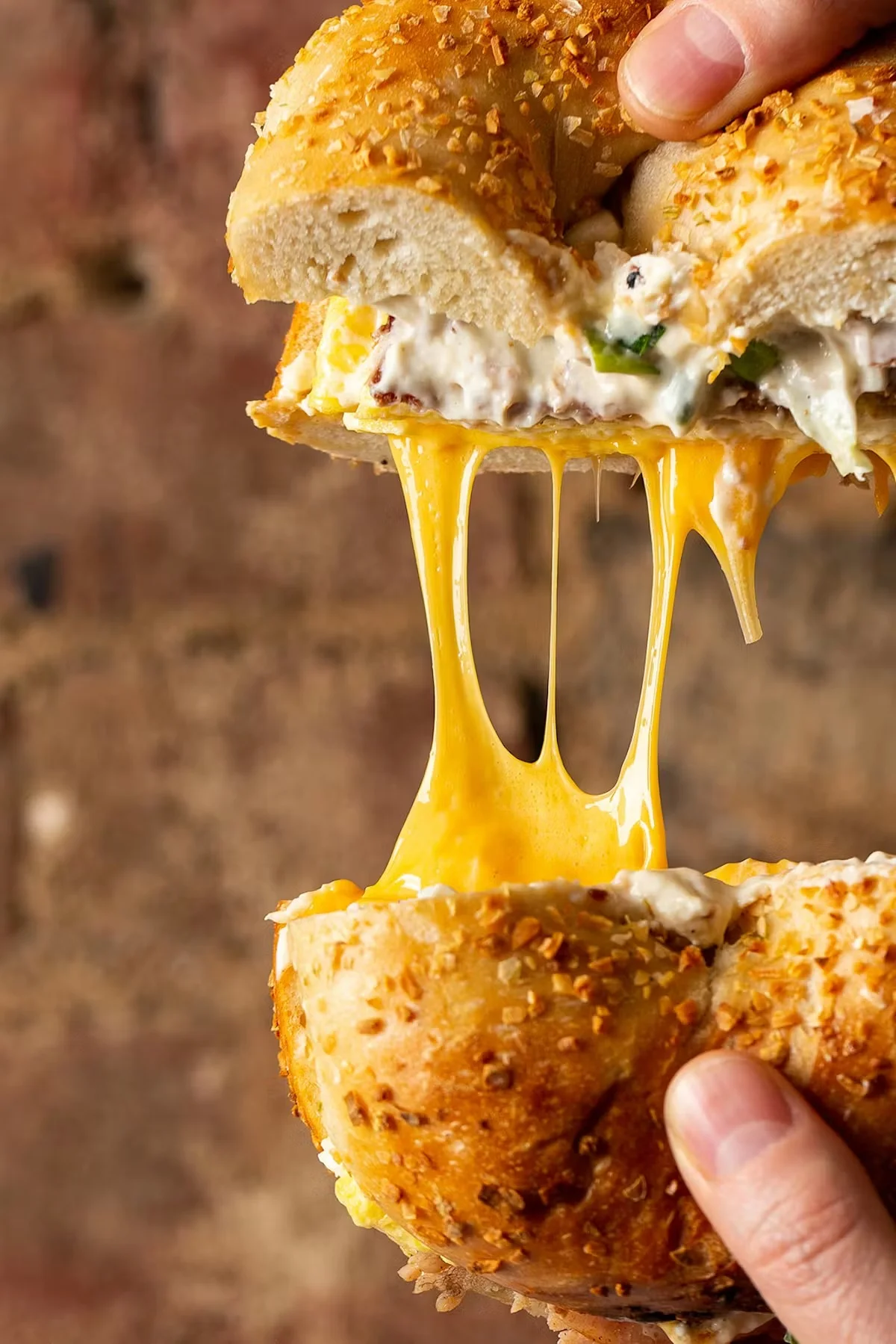 Delicious gourmet burger with fresh toppings on a wooden table