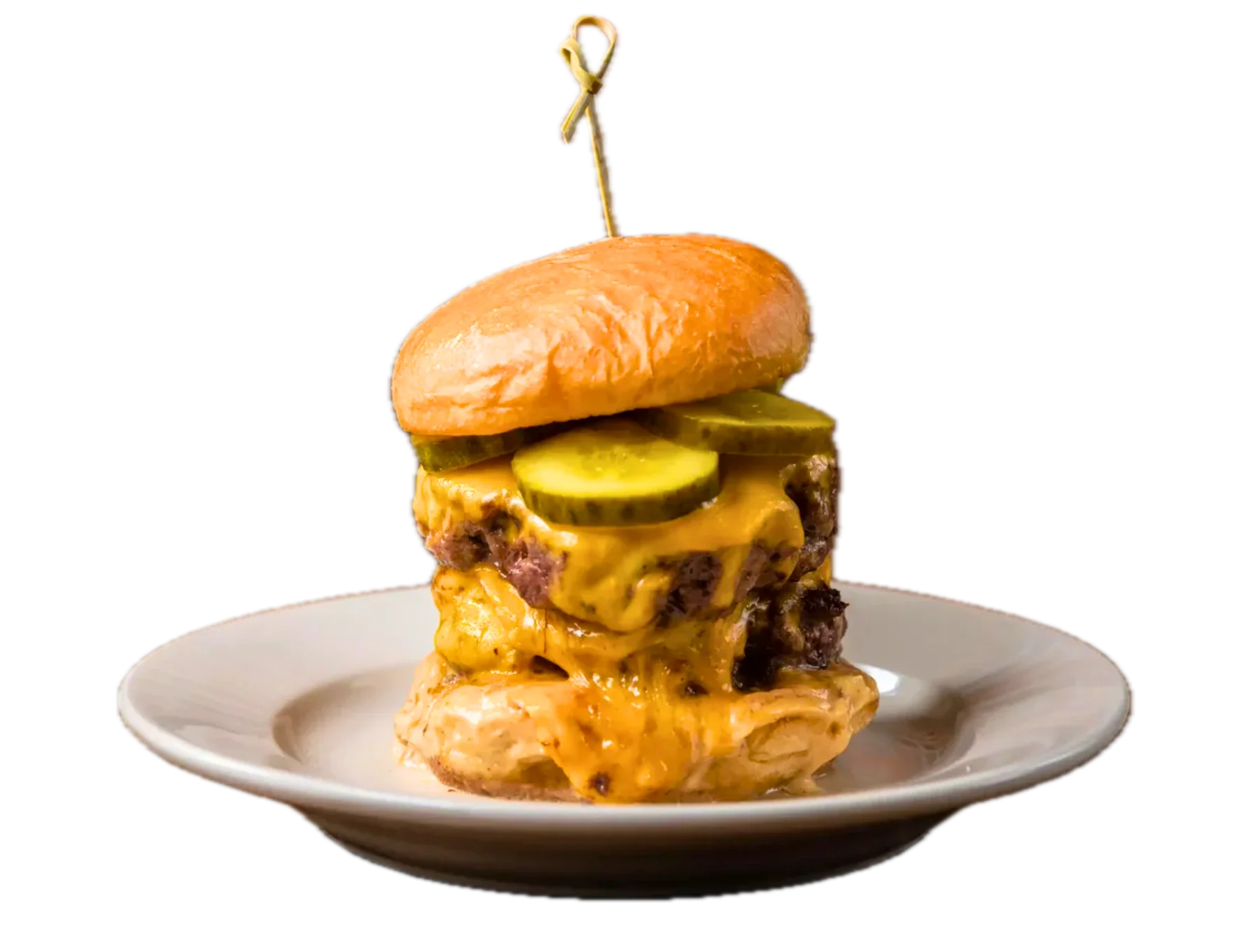 Juicy cheeseburger with pickles on a toasted bun