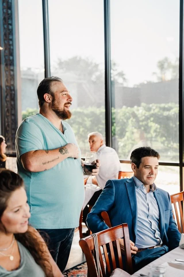 Casual dining scene with guests enjoying drinks and conversation