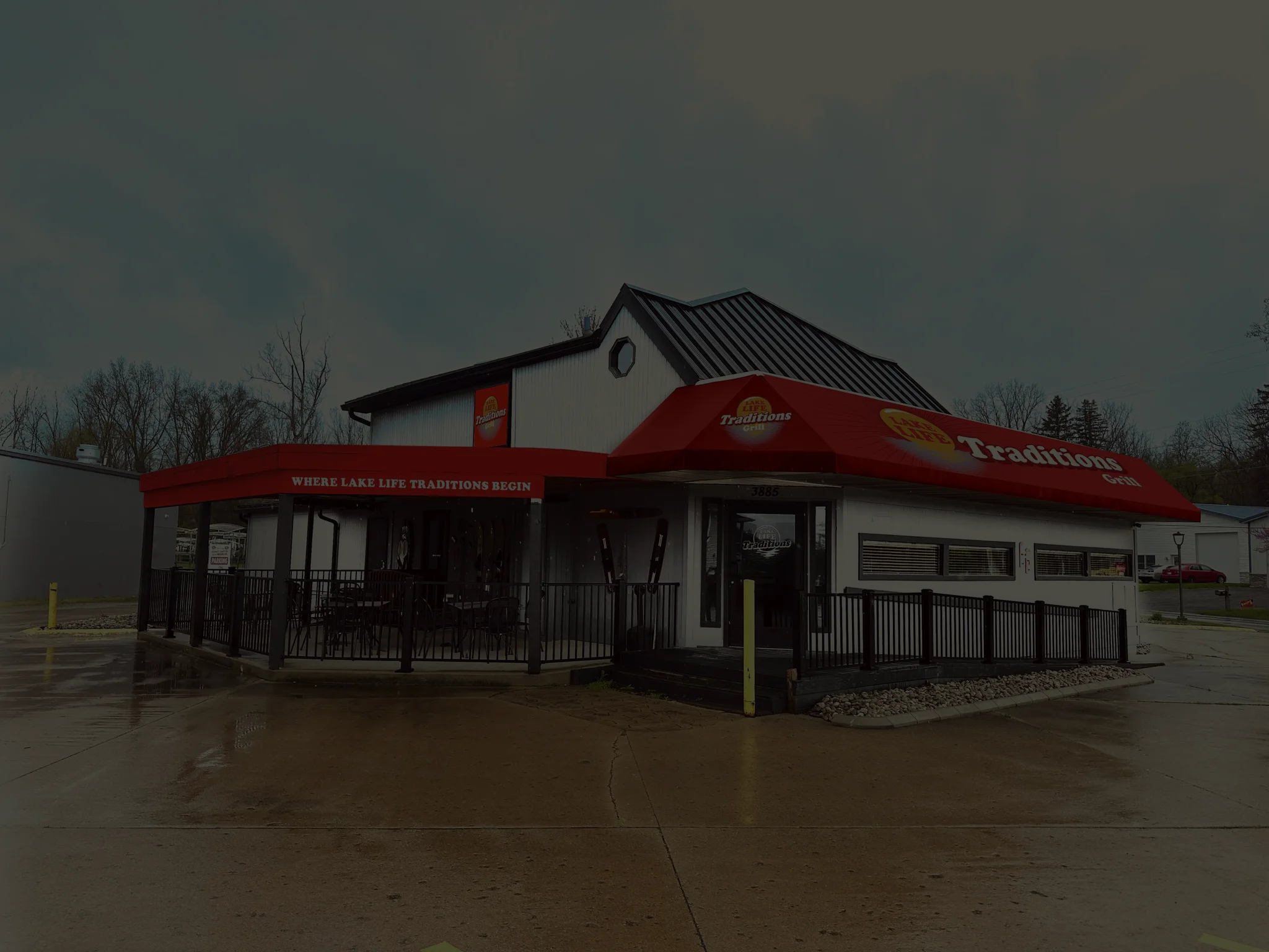 Exterior view of Traditions Grill restaurant with red awning