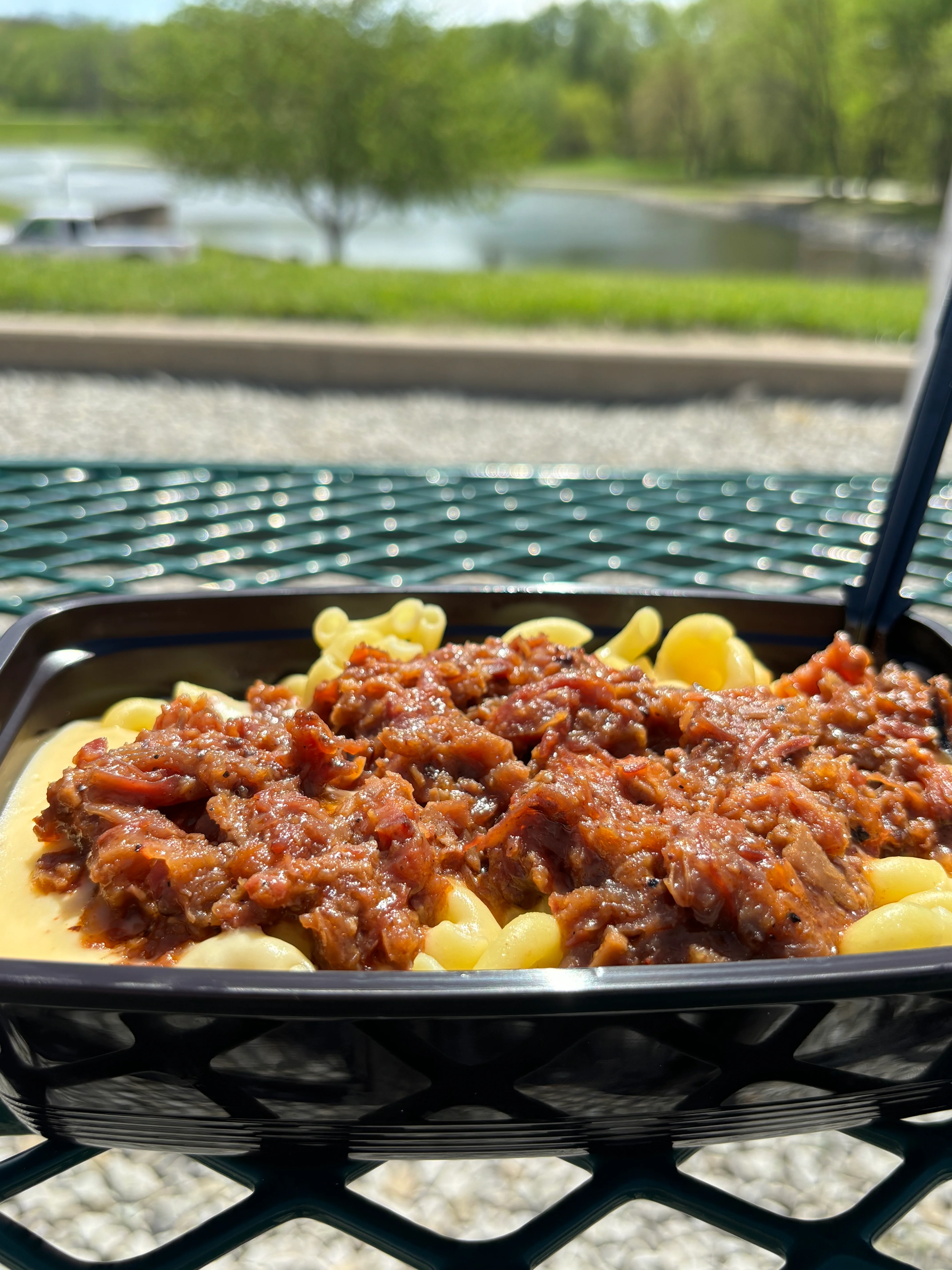 BBQ pulled pork mac and cheese bowl by the lake
