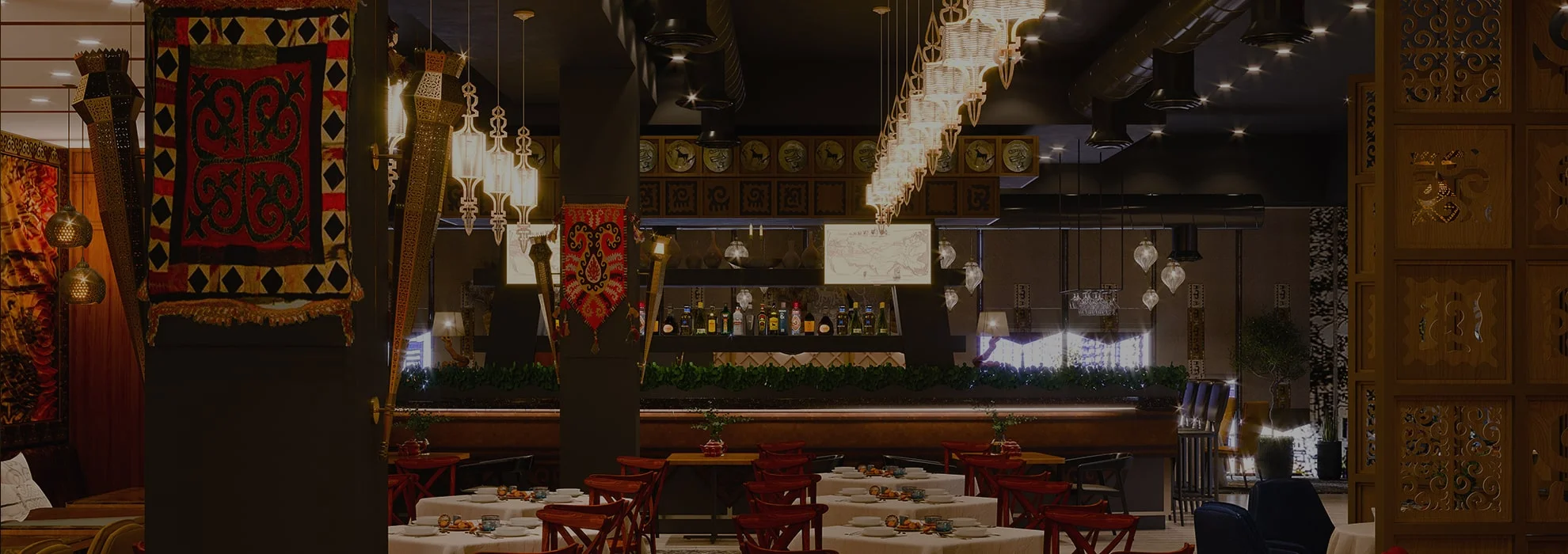 Elegant restaurant interior with decorative lighting and traditional textiles
