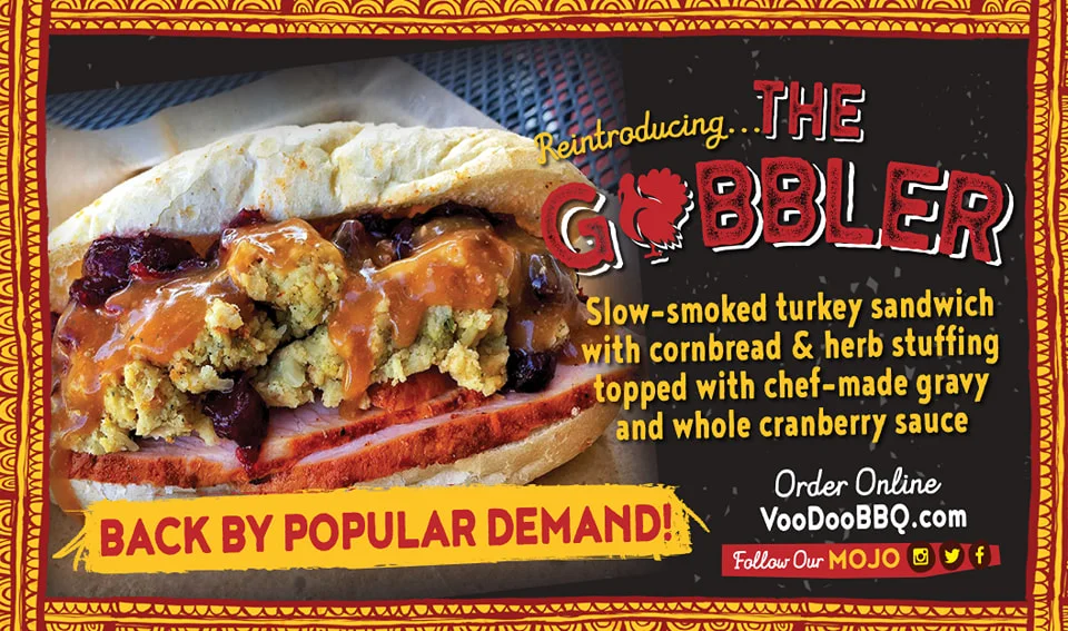 Gobbler sandwich at VooDoo BBQ in Pensacola featuring slow-smoked turkey, cornbread dressing, cranberry sauce, and turkey gravy..