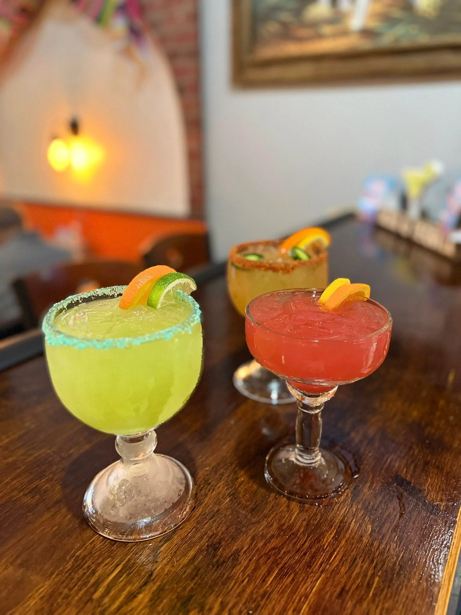Colorful margaritas served in a vibrant restaurant setting