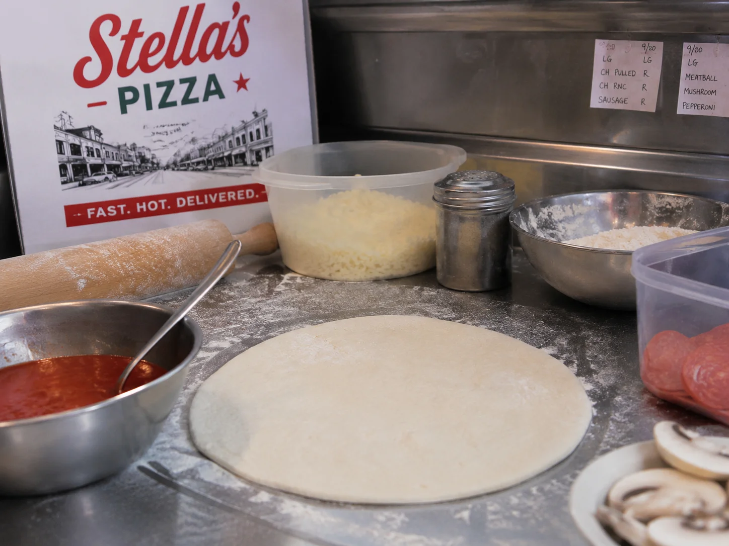 Pizza preparation station with dough and sauce