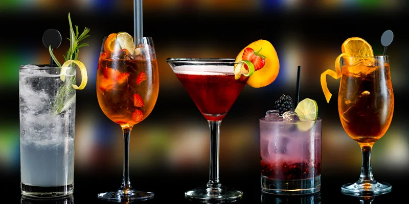 Colorful cocktails displayed on a bar counter