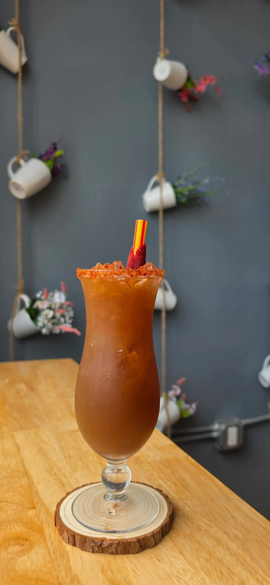 Refreshing Mexican michelada cocktail with a colorful straw