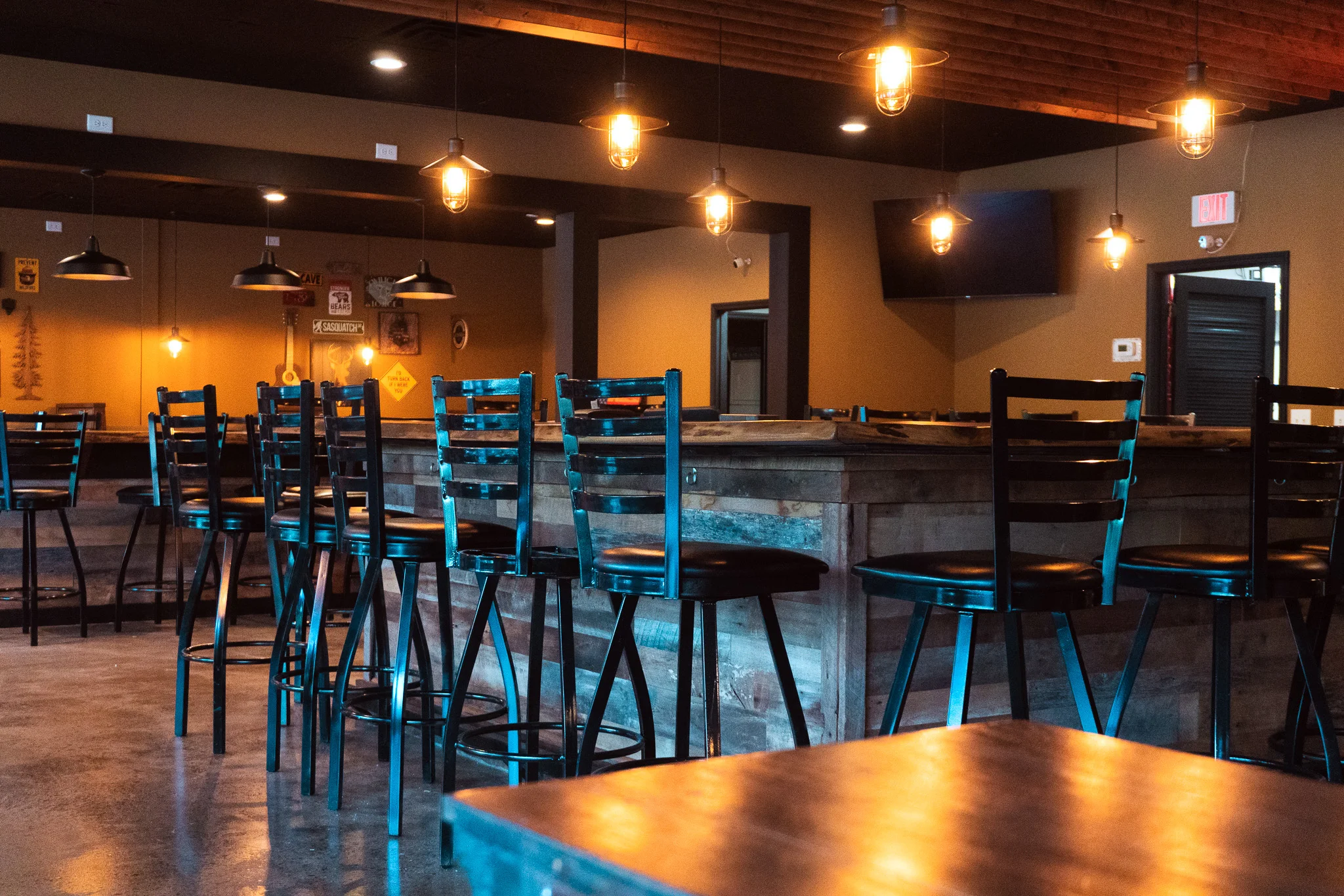 Cozy bar interior with wooden accents and warm lighting