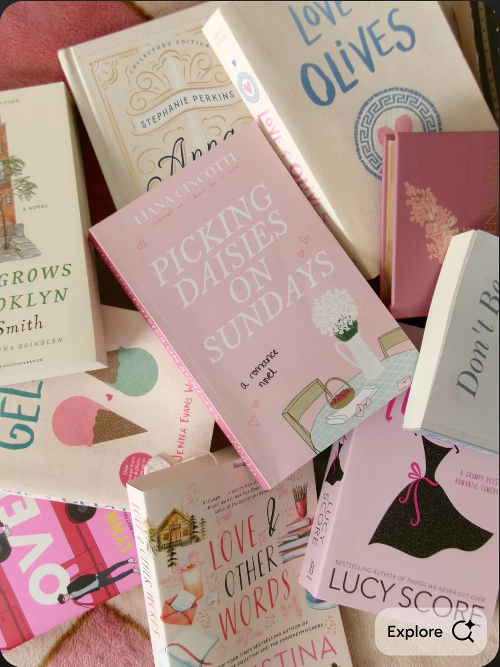 Collection of contemporary romance novels stacked on a cozy surface