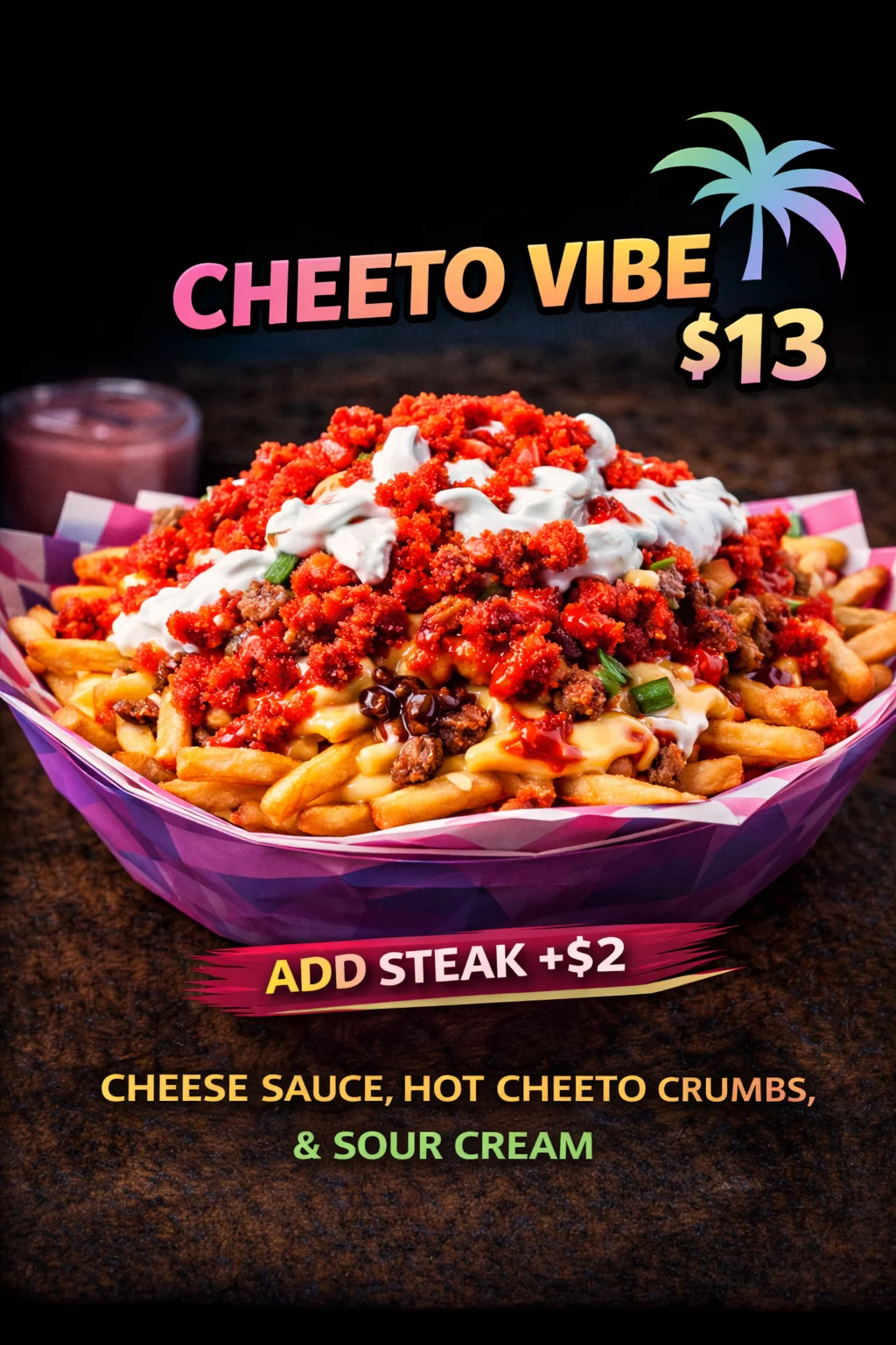 A vibrant dish featuring fries topped with cheese sauce, hot cheeto crumbs, and sour cream, garnished with meat and colorful toppings, served in a decorative bowl.