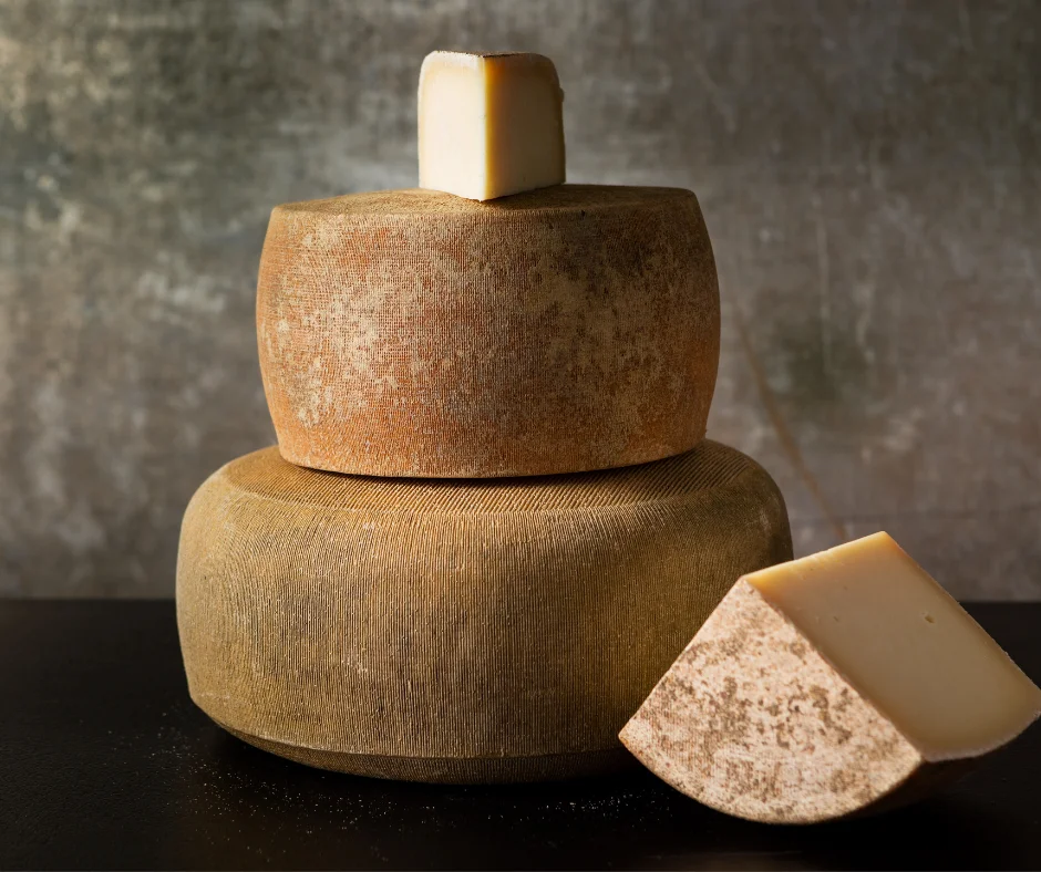 Artisan cheese wheels stacked elegantly