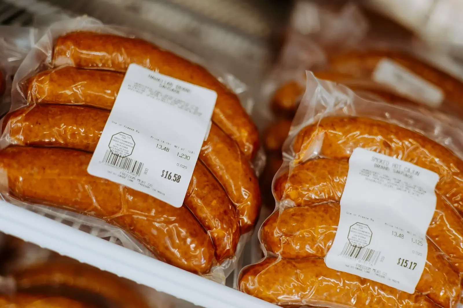 Cajun smoked sausage packs in a grocery store