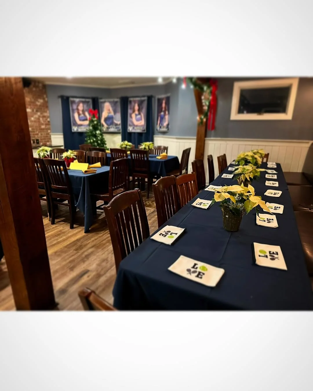 Cozy restaurant dining area with festive decor and tables set for guests