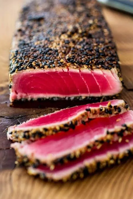 Seared sesame-crusted tuna sashimi slices