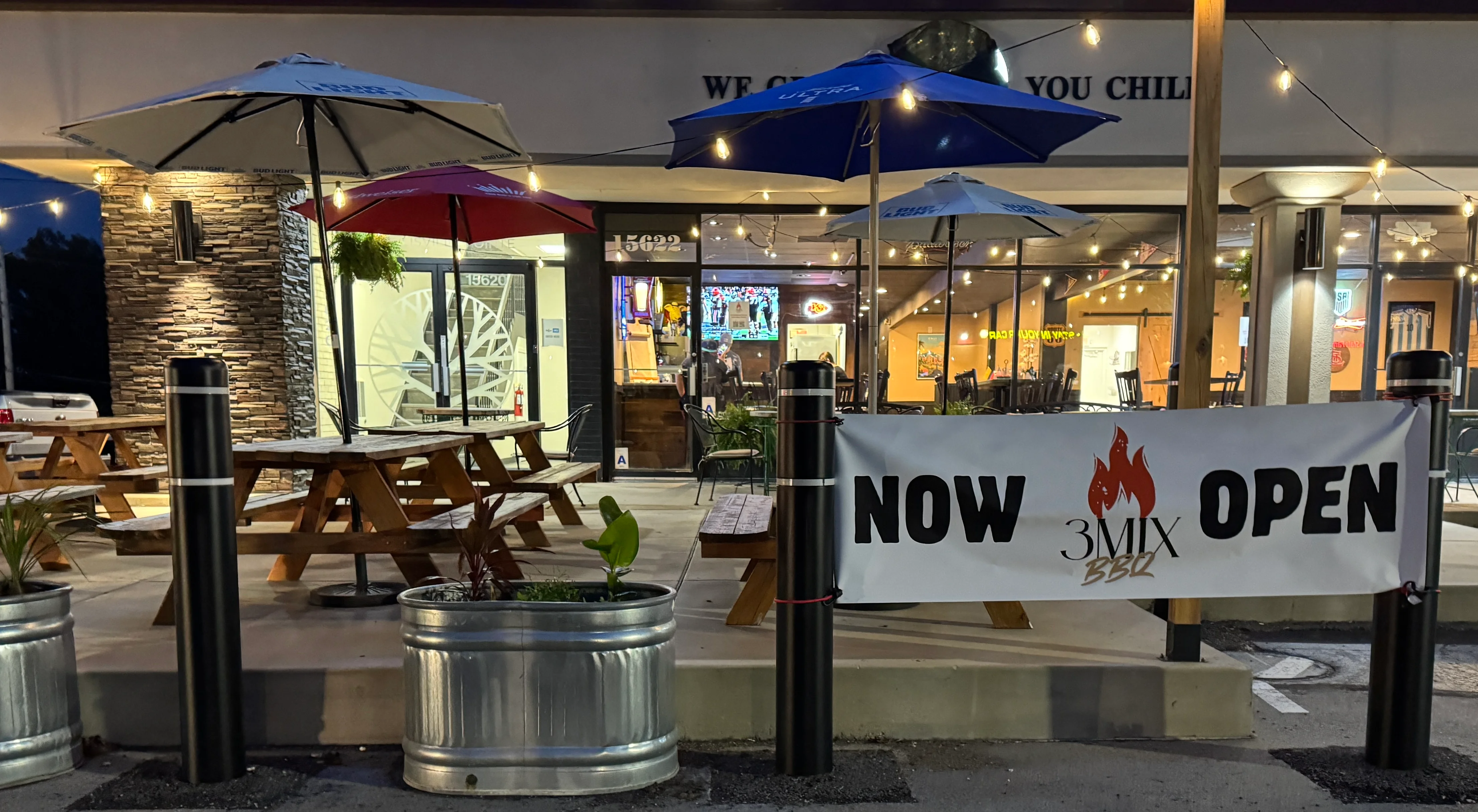 Outdoor dining area of 3Mix BBQ restaurant with umbrellas