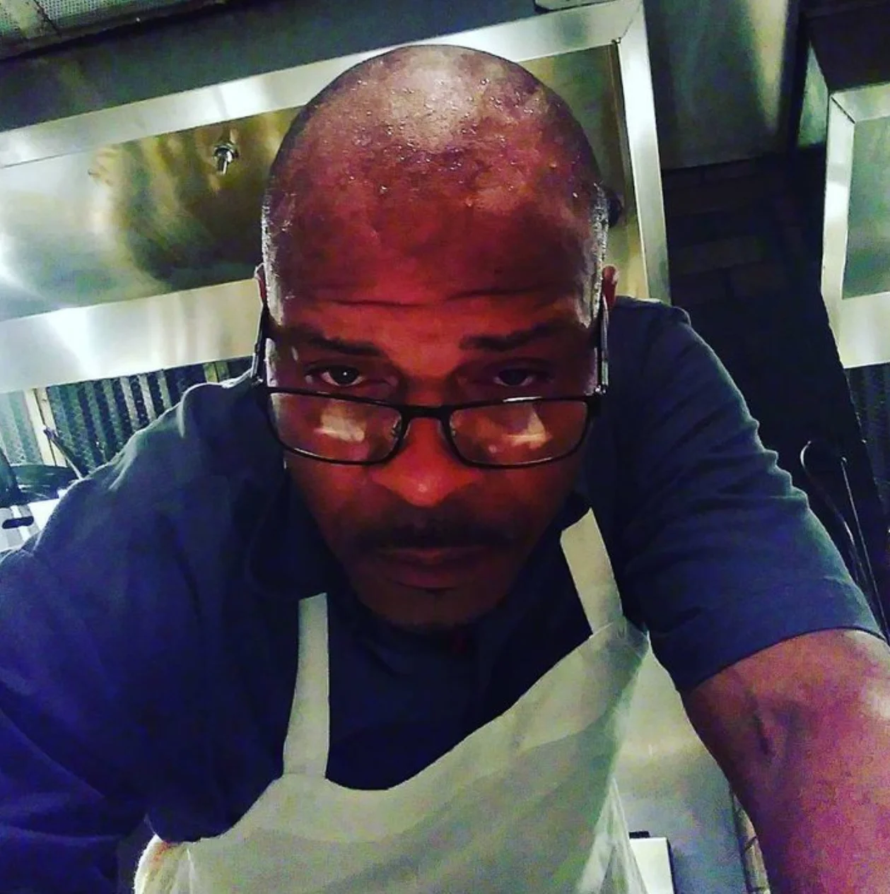 A restaurant chef preparing a dish