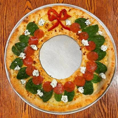 Festive holiday pizza shaped like a wreath