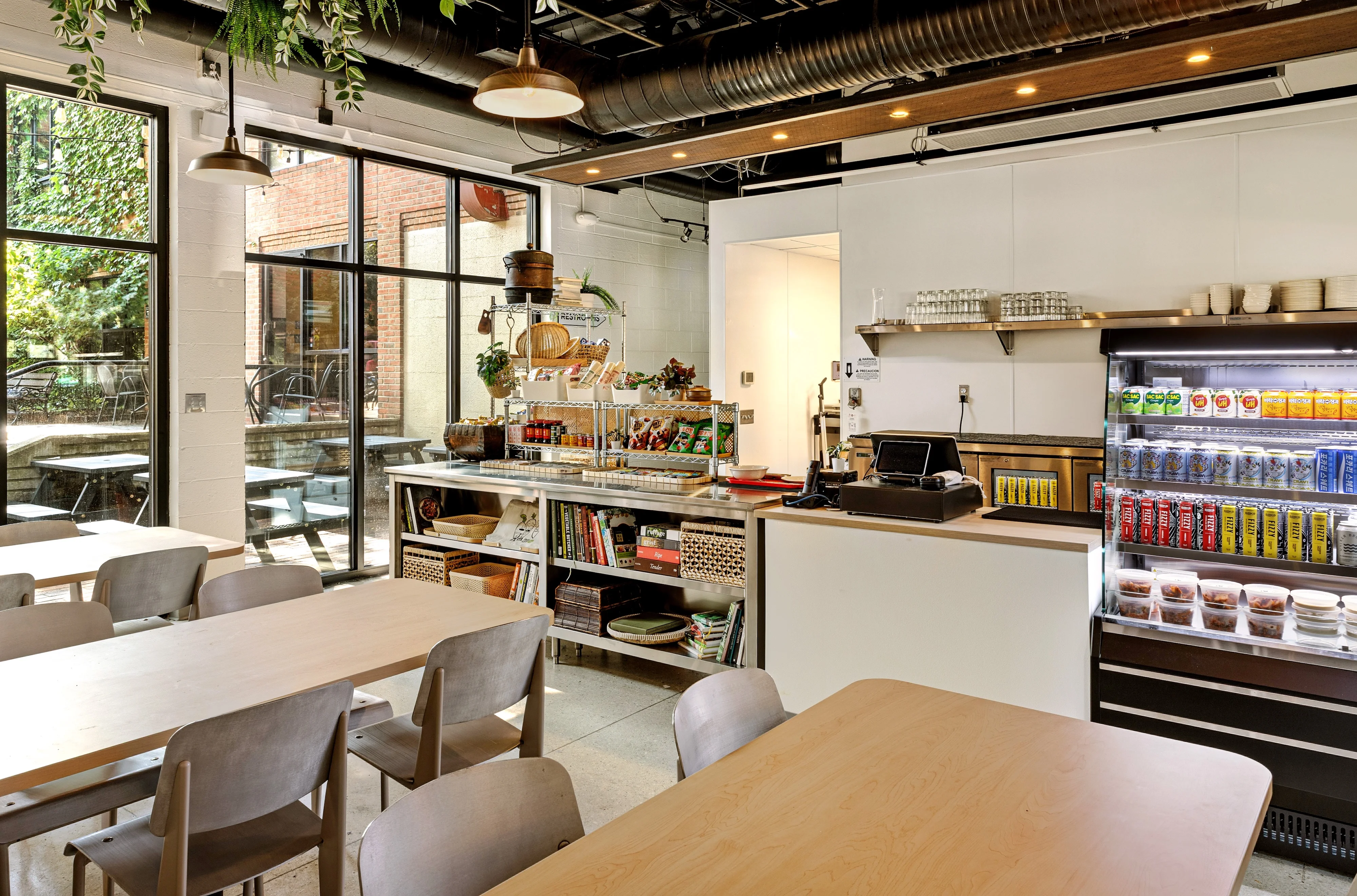 Modern restaurant interior with natural light and cozy seating