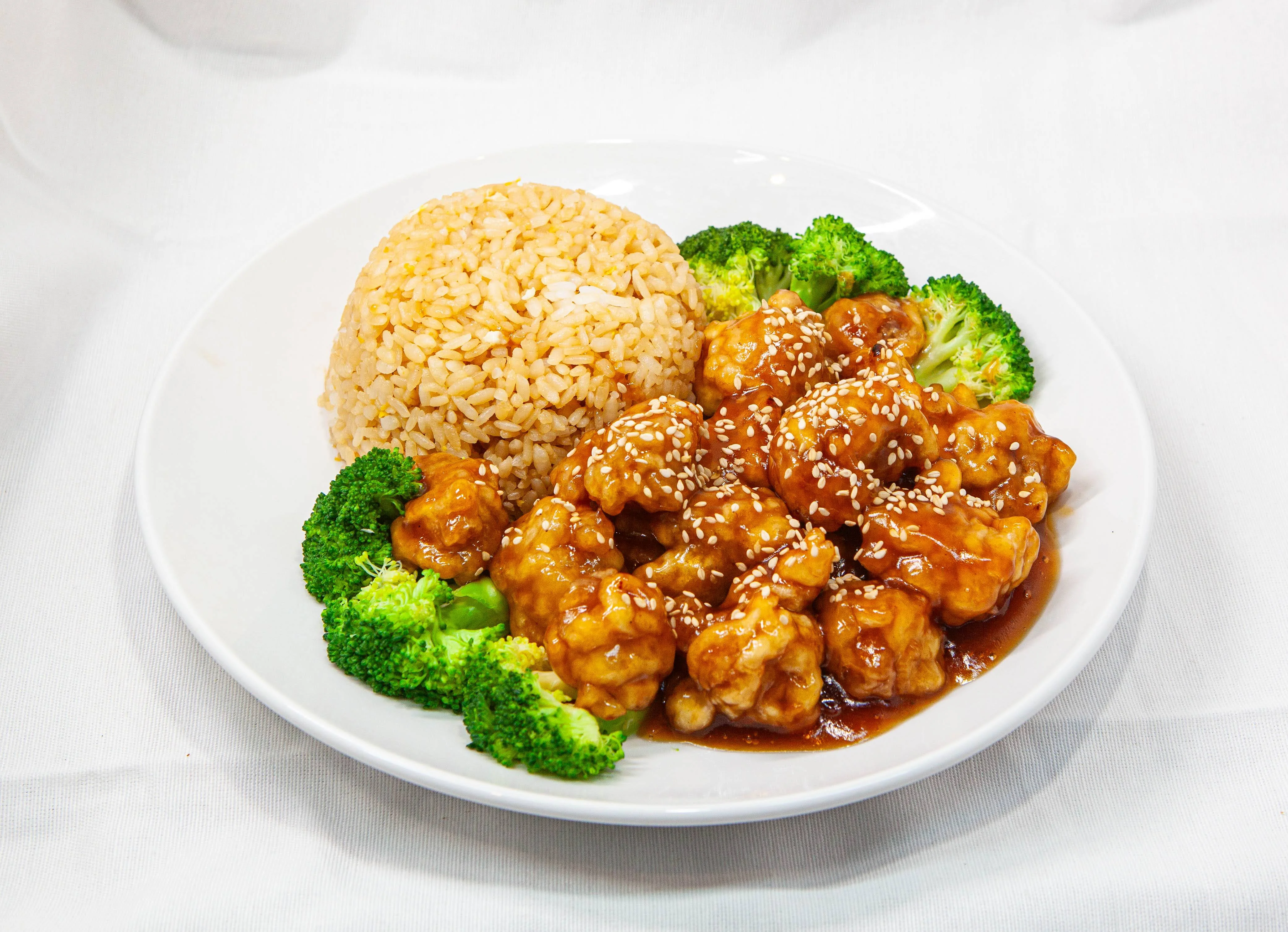 Sweet and sour chicken with fried rice and broccoli