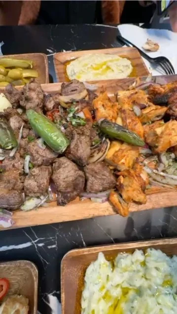 Mixed grill platter featuring kebabs and grilled meats