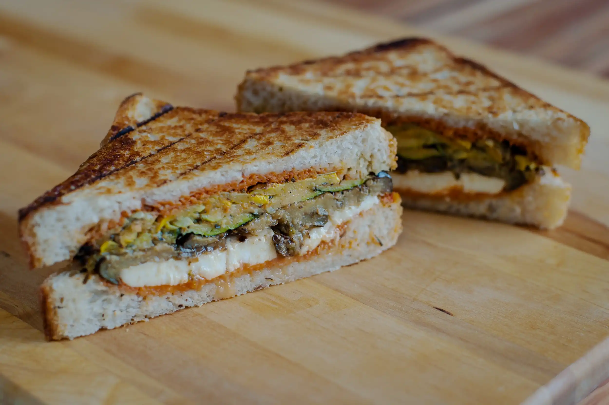 The Gio sandwich has roasted zucchini, squash, carrots & mozza- rella with a house-made walnut-red pepper pesto on grilled ciabatta.