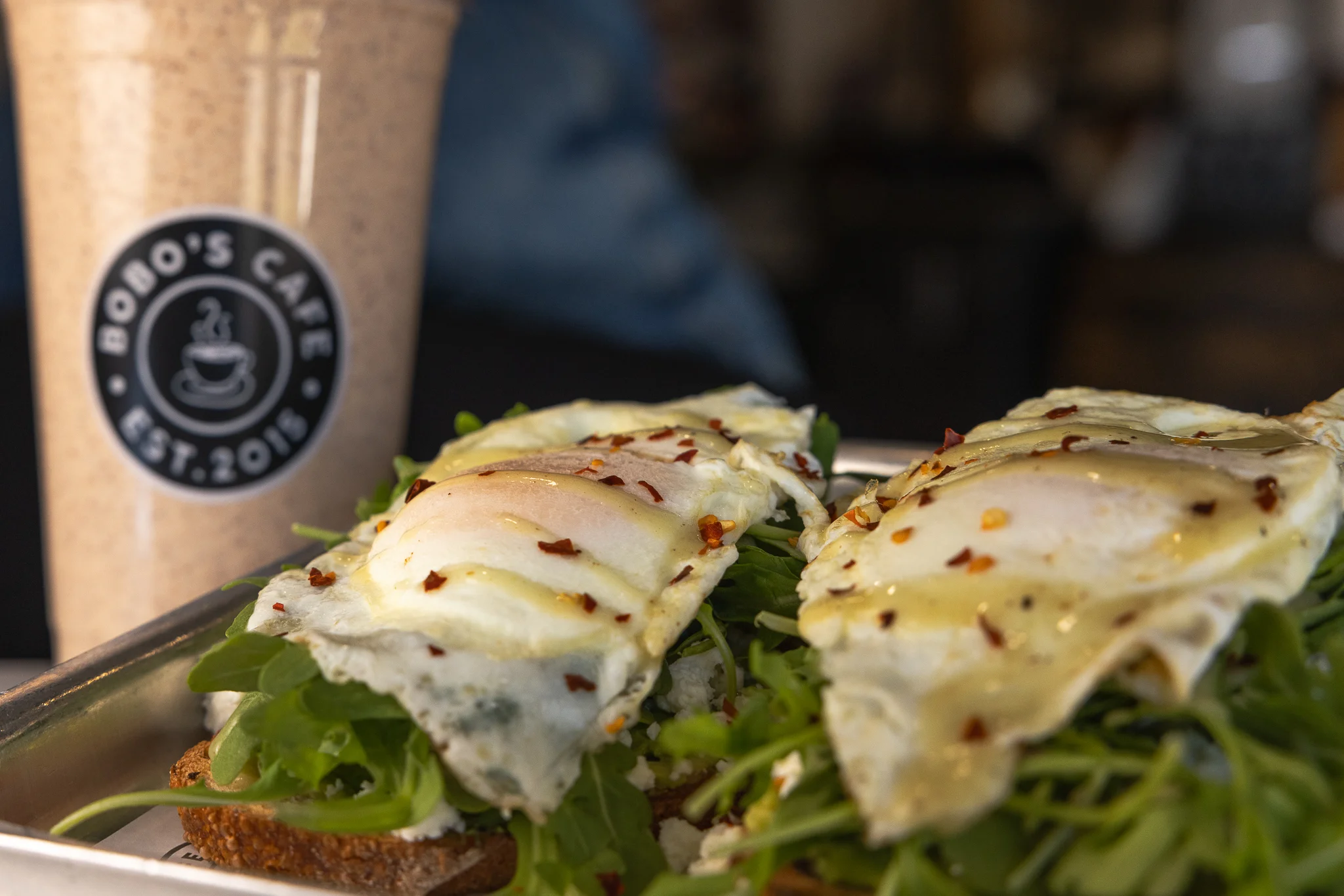 Open-faced egg sandwich with arugula