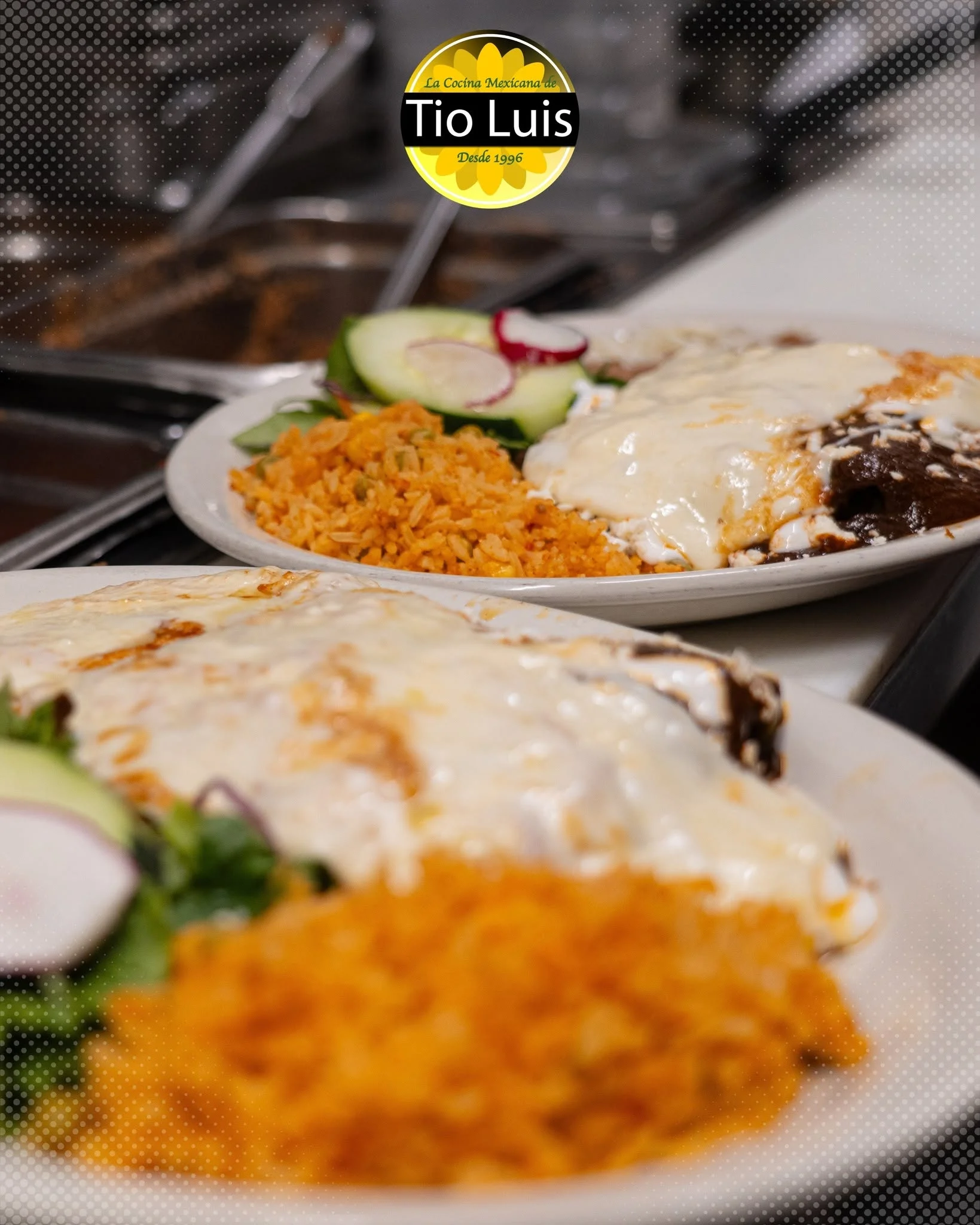 Delicious Mexican enchiladas topped with cheese and served with rice