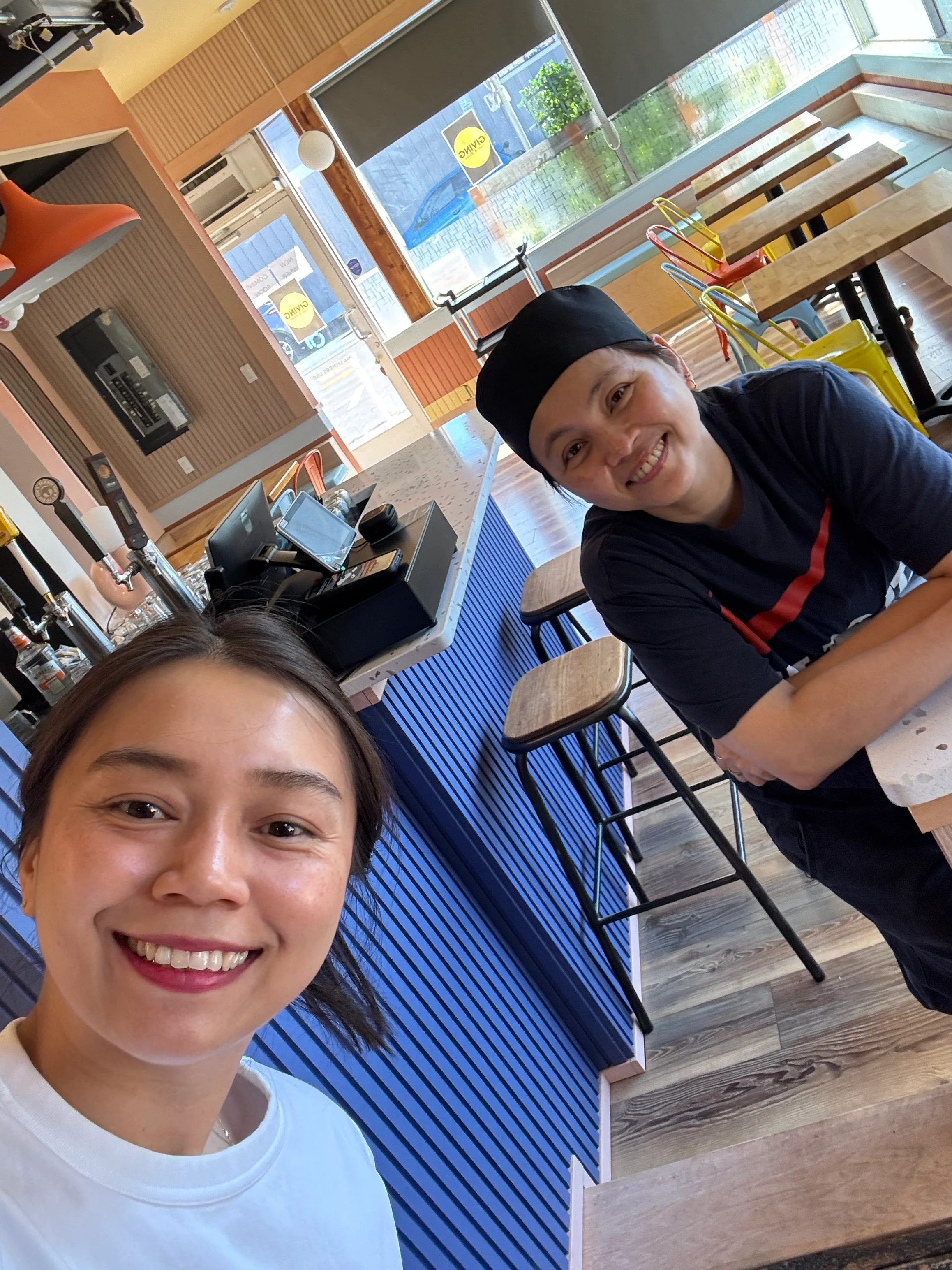 Friendly staff in a modern restaurant interior