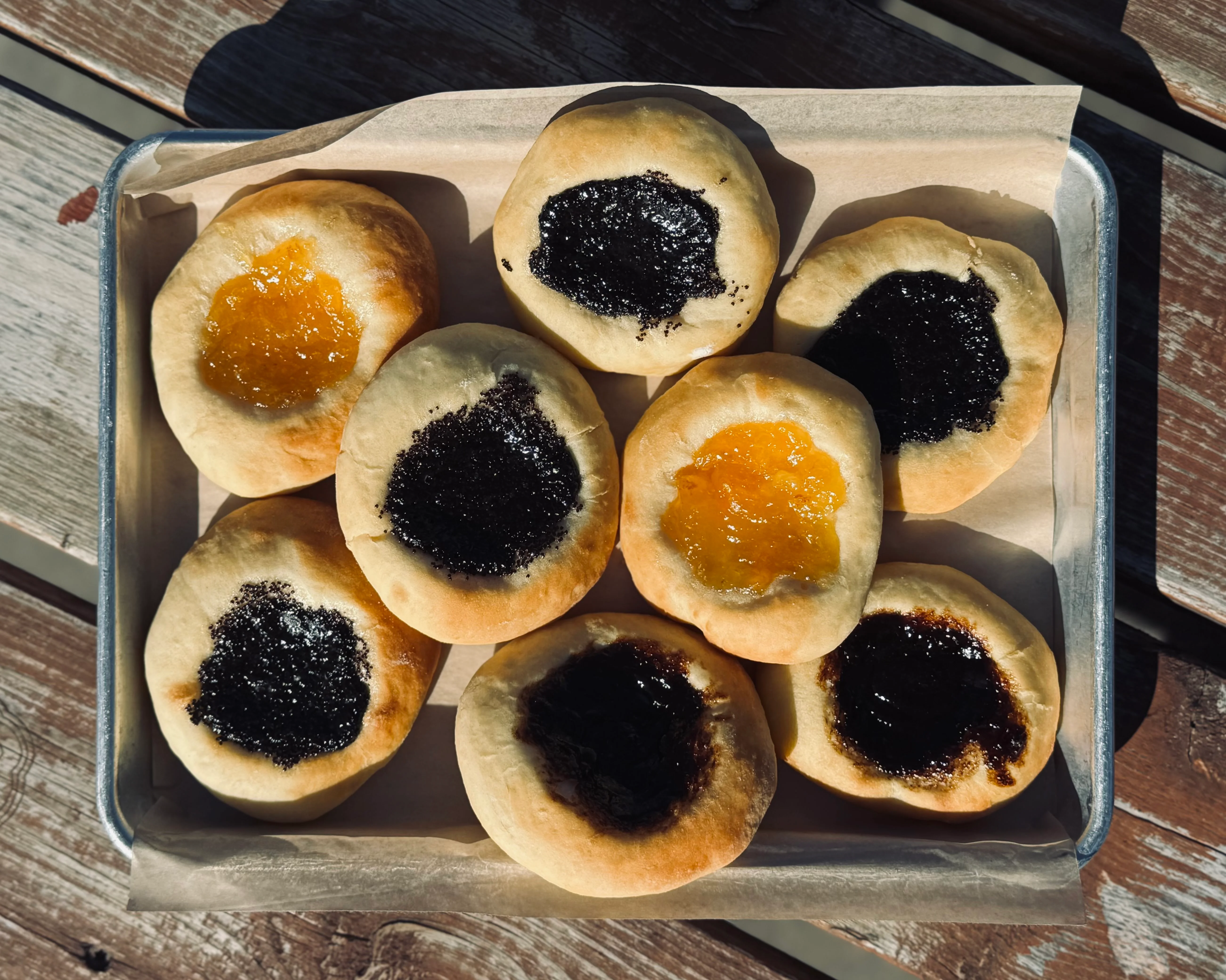 Hungarian poppy seed and apricot pastries on a tray
