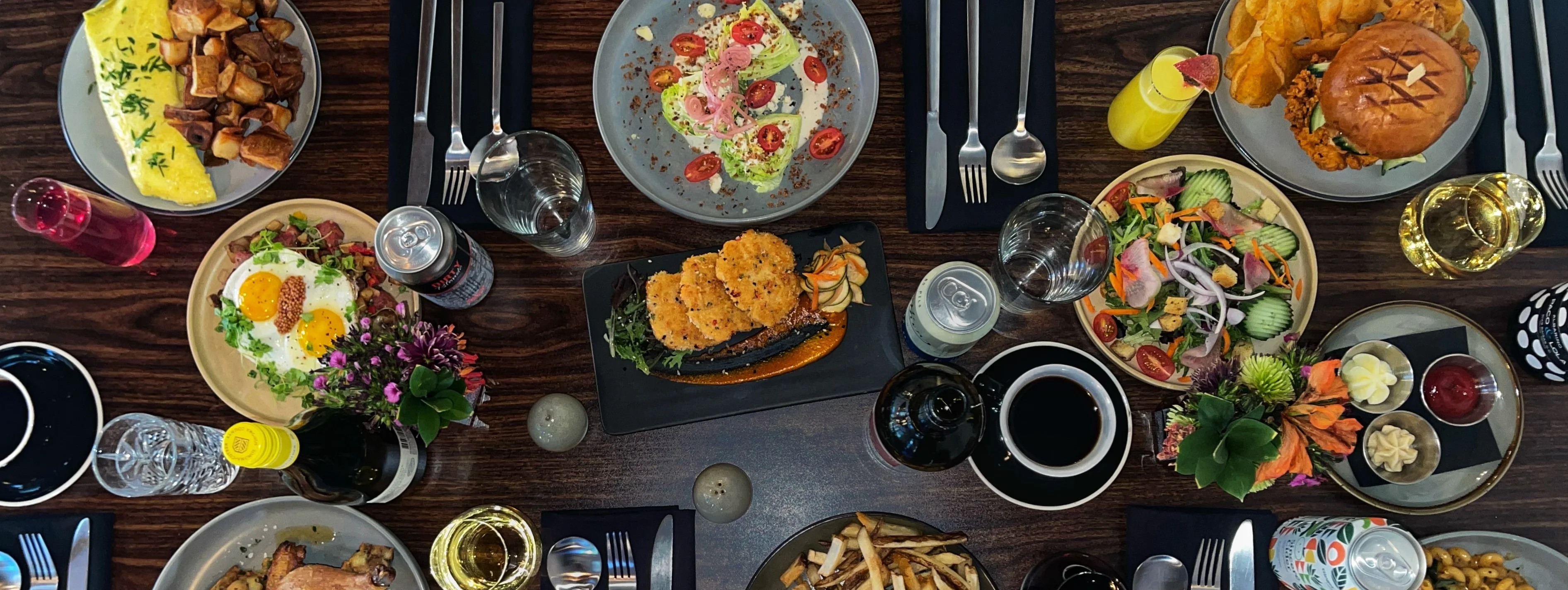 Brunch spread featuring various dishes and drinks