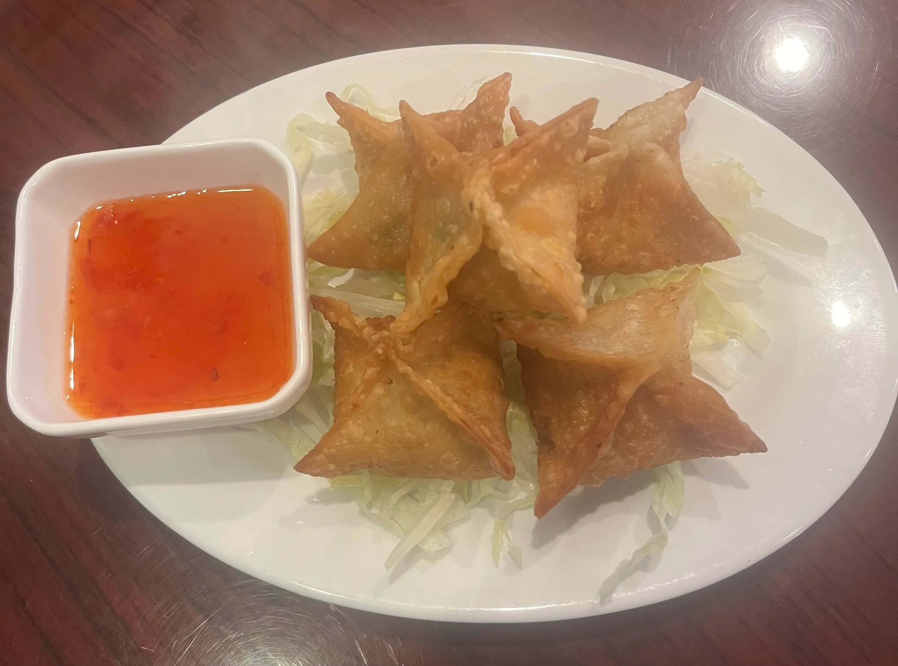 Crispy Thai wontons served with sweet chili sauce