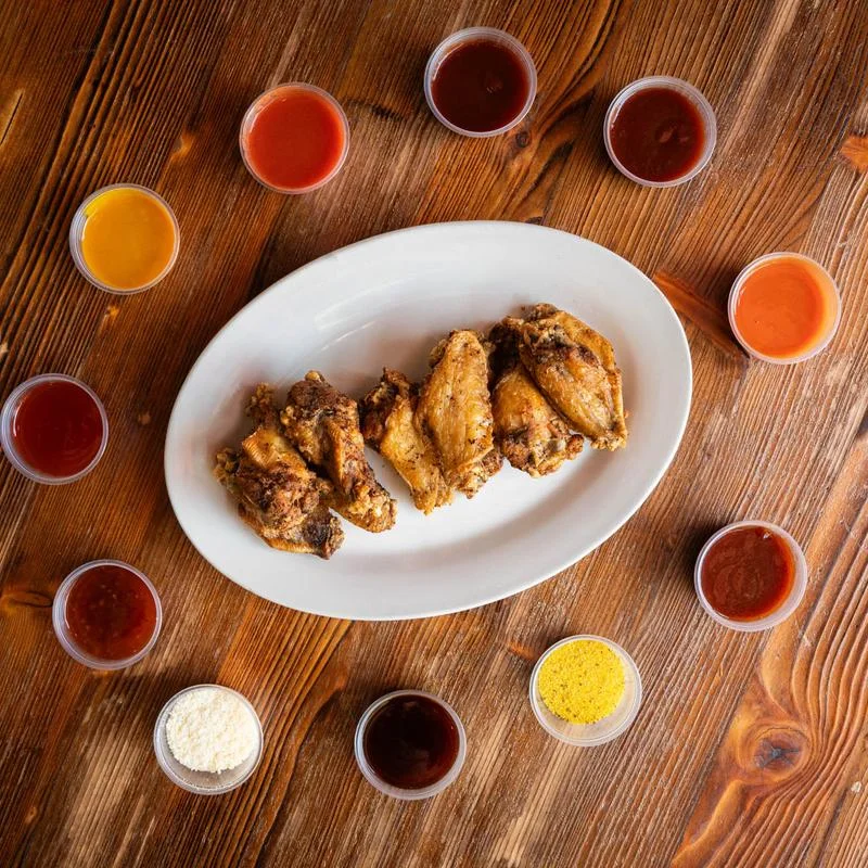 Crispy chicken wings with assorted dipping sauces