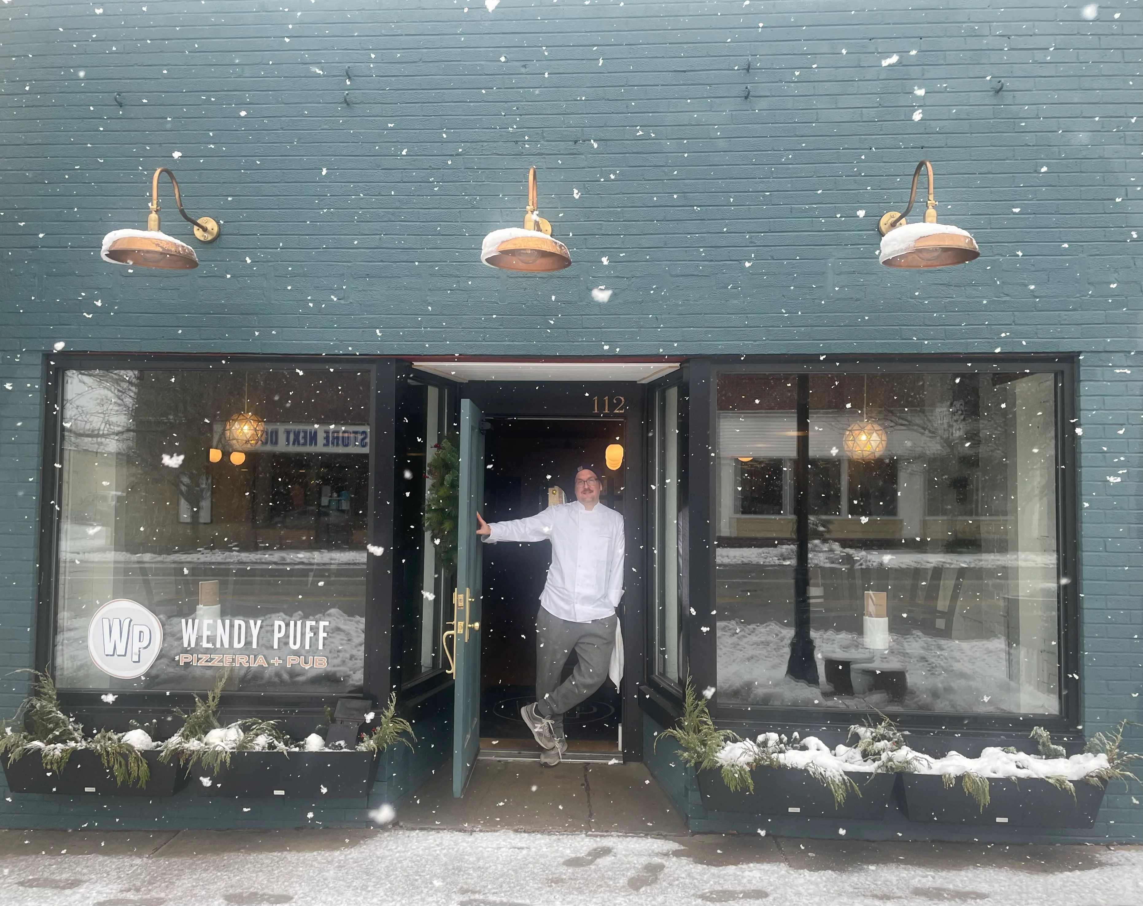 Welcoming restaurant entrance in snowy weather