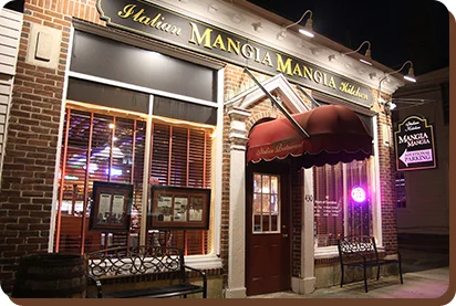 Charming Italian restaurant exterior at night