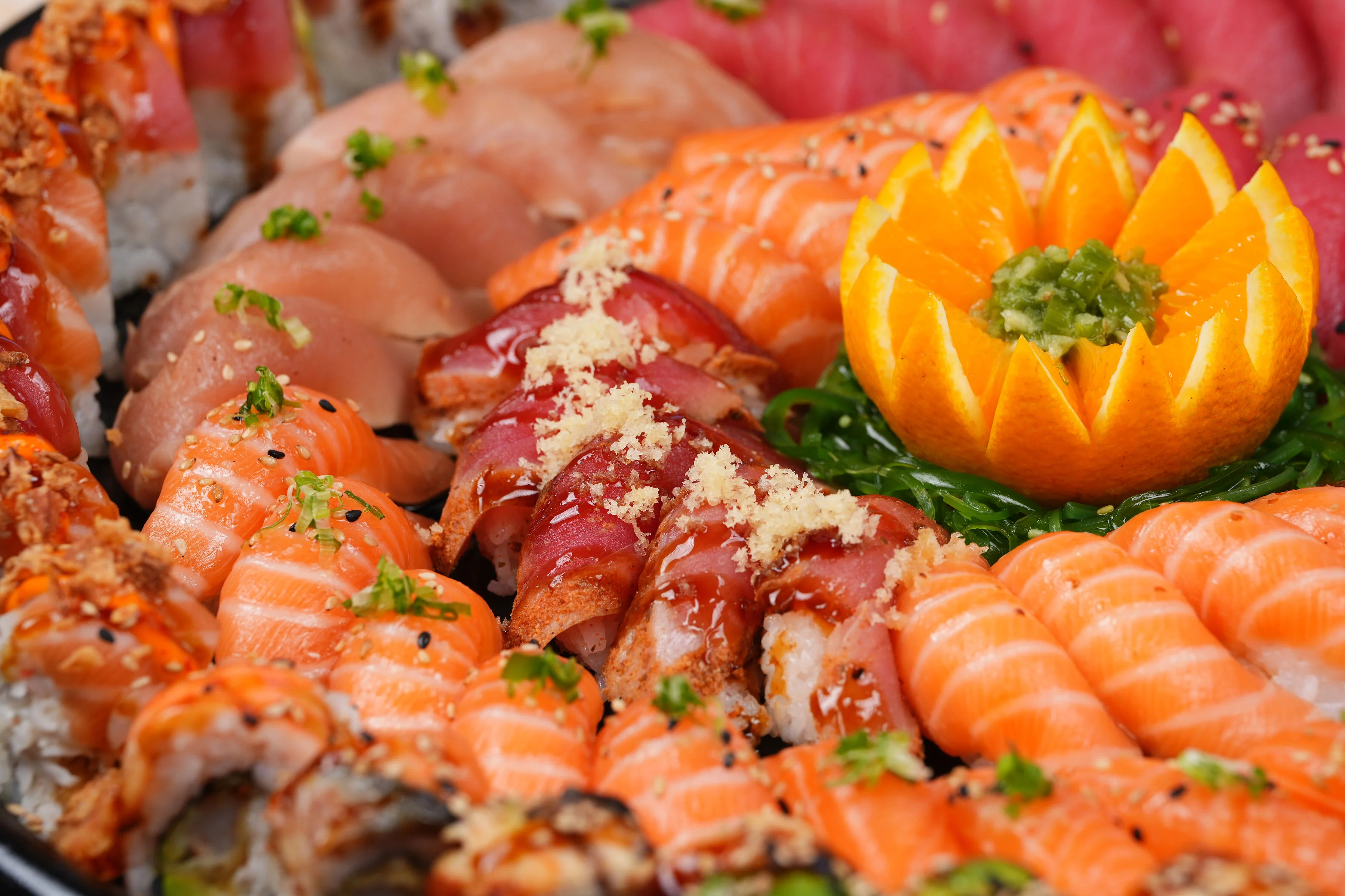 Assorted Japanese sushi platter with fresh fish and garnishes