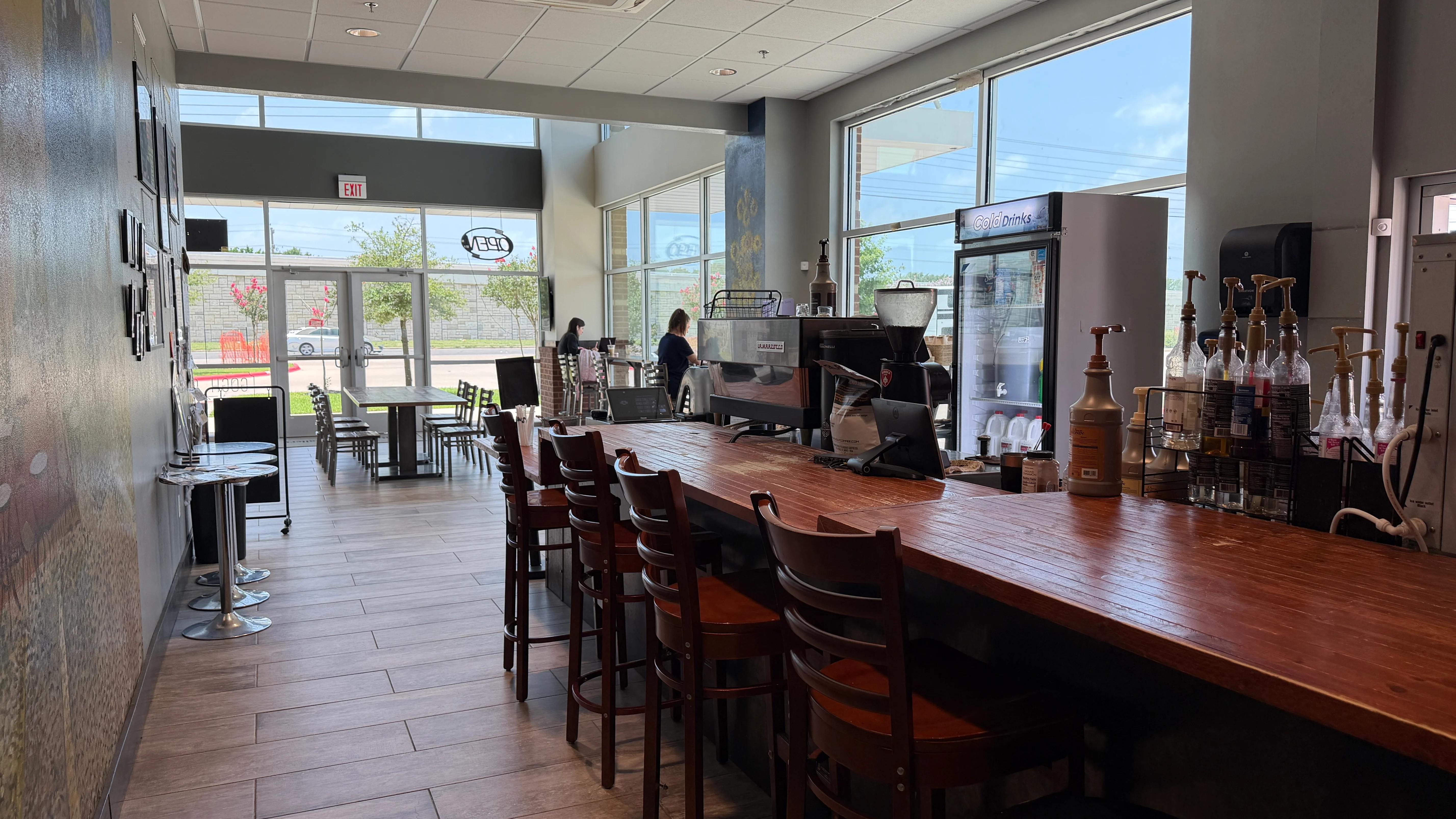Modern café interior with wooden bar and seating