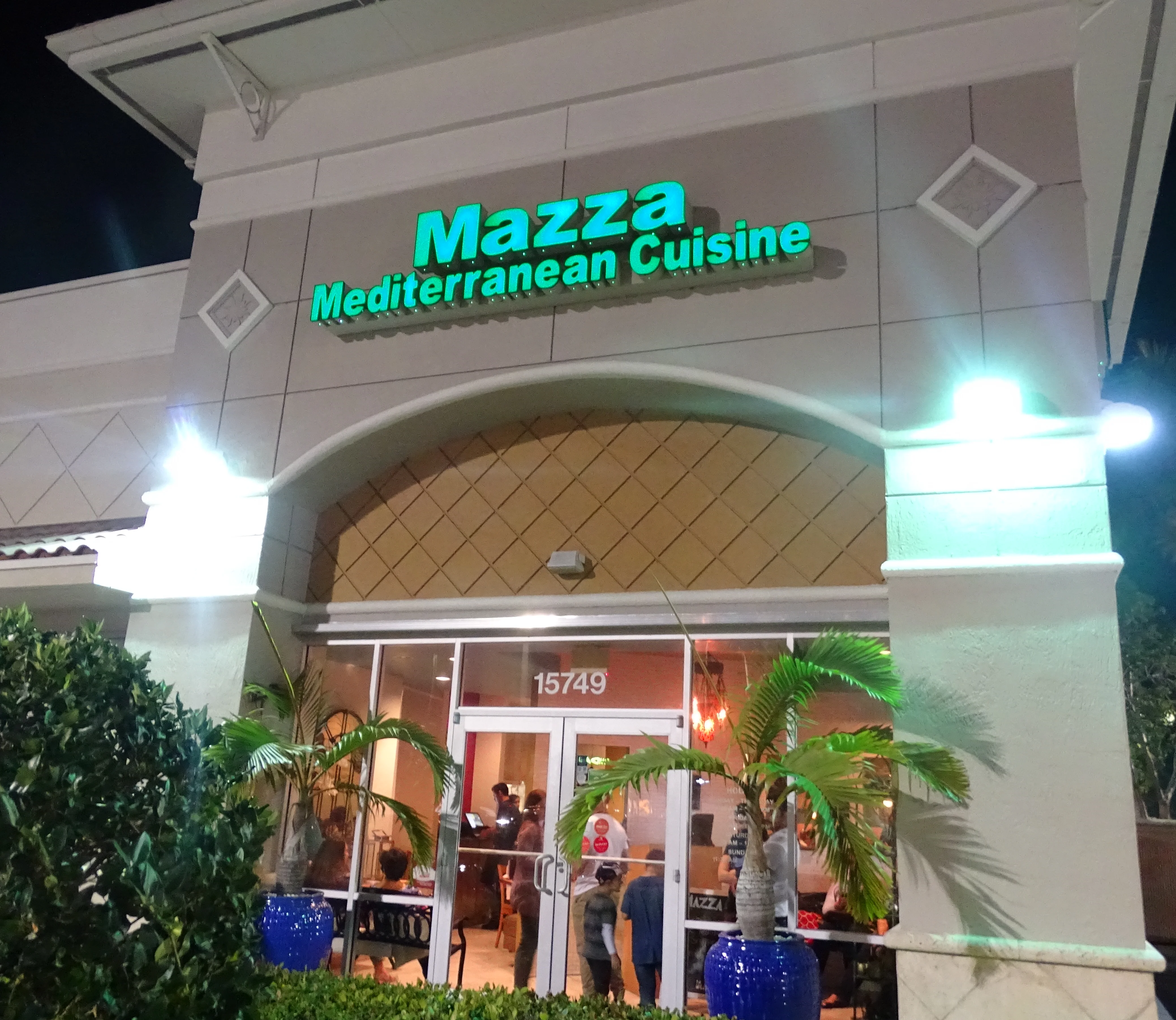 Exterior view of Mazza Mediterranean Cuisine restaurant at night