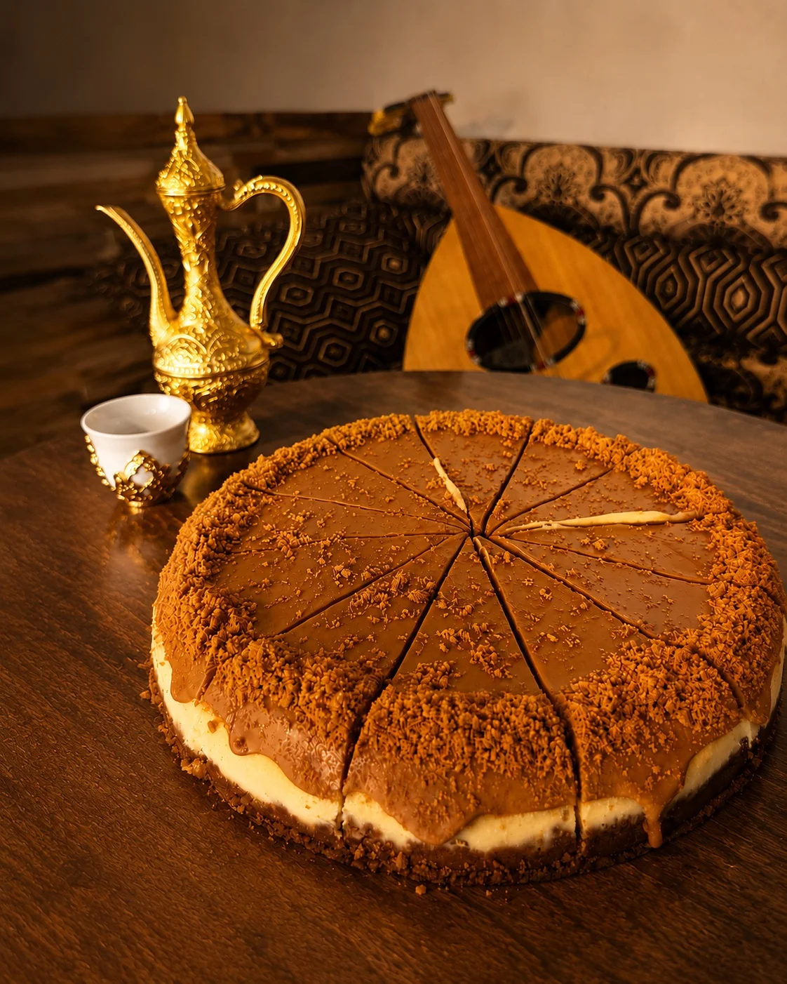 Delicious layered cake with coffee topping, served with traditional coffee pot.