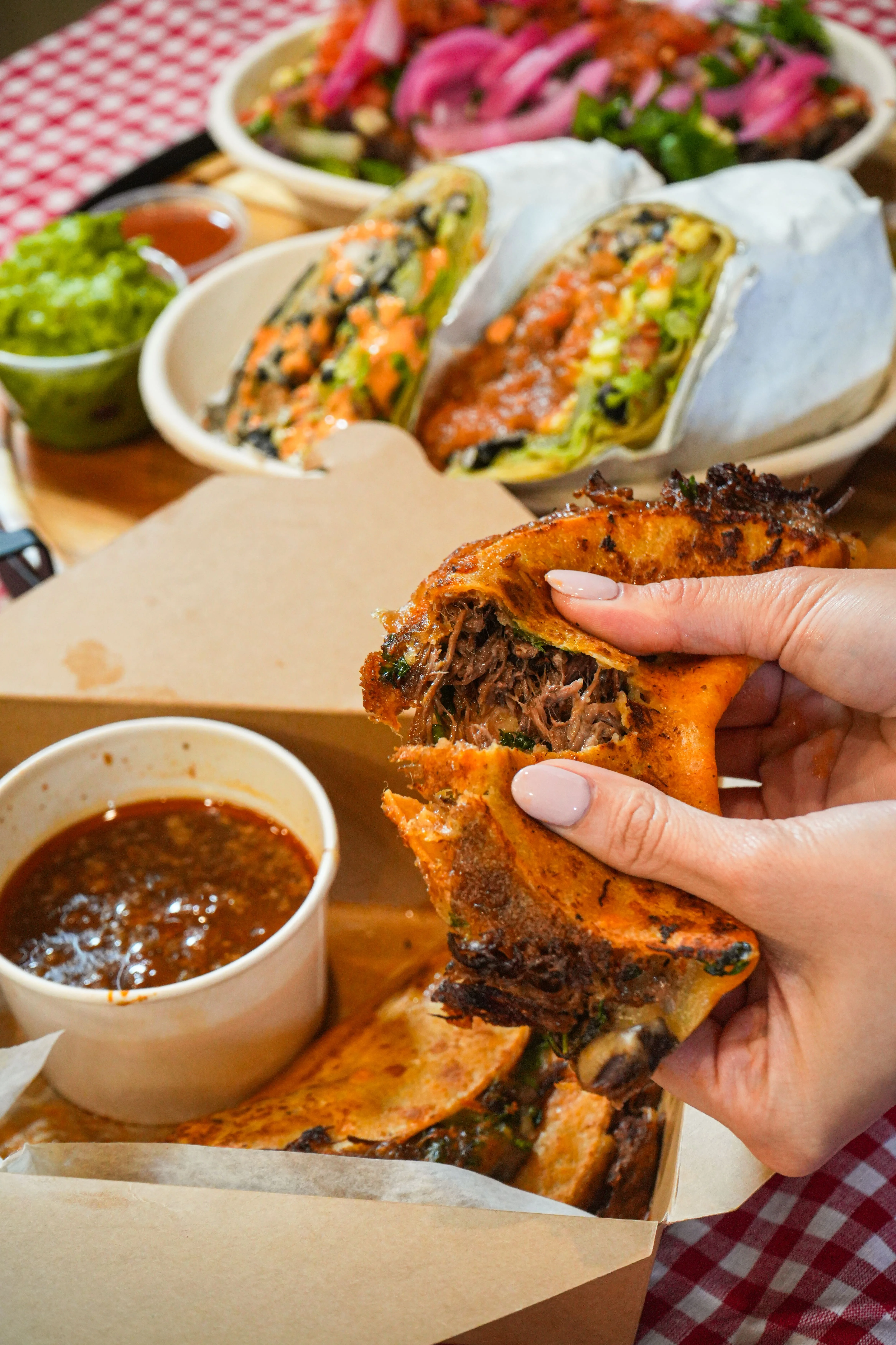 A logo for 'SAVI Mexican Grill', featuring bold text and a flame icon.