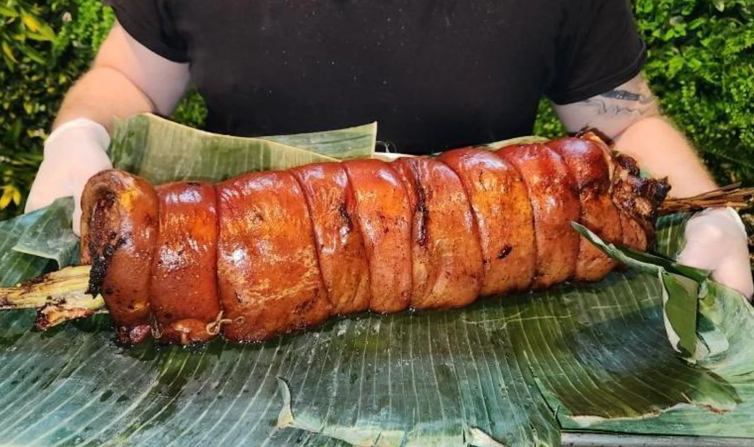 cebuchon pork belly roll served on banana leaves