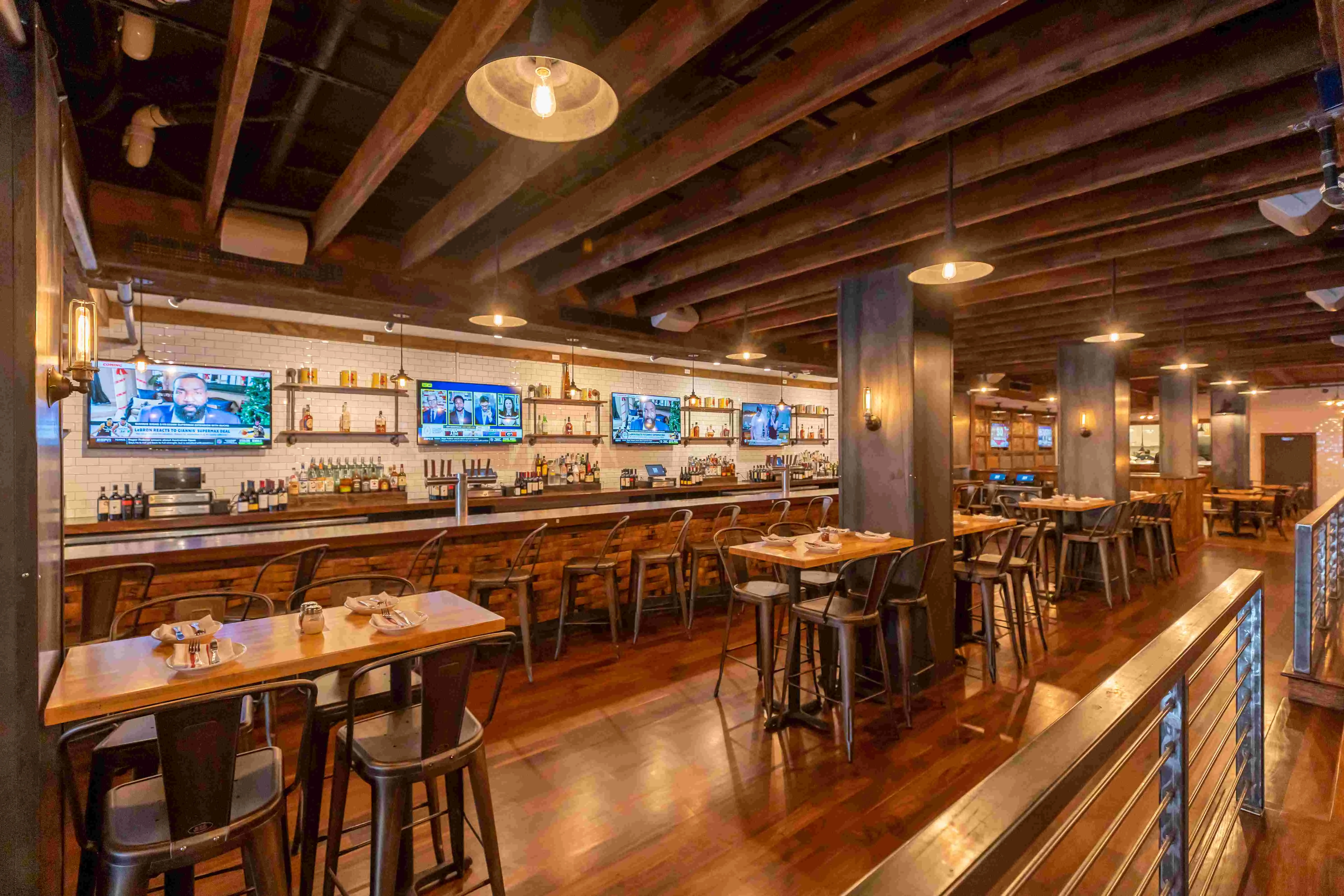 Cozy restaurant interior with wooden beams and bar seating