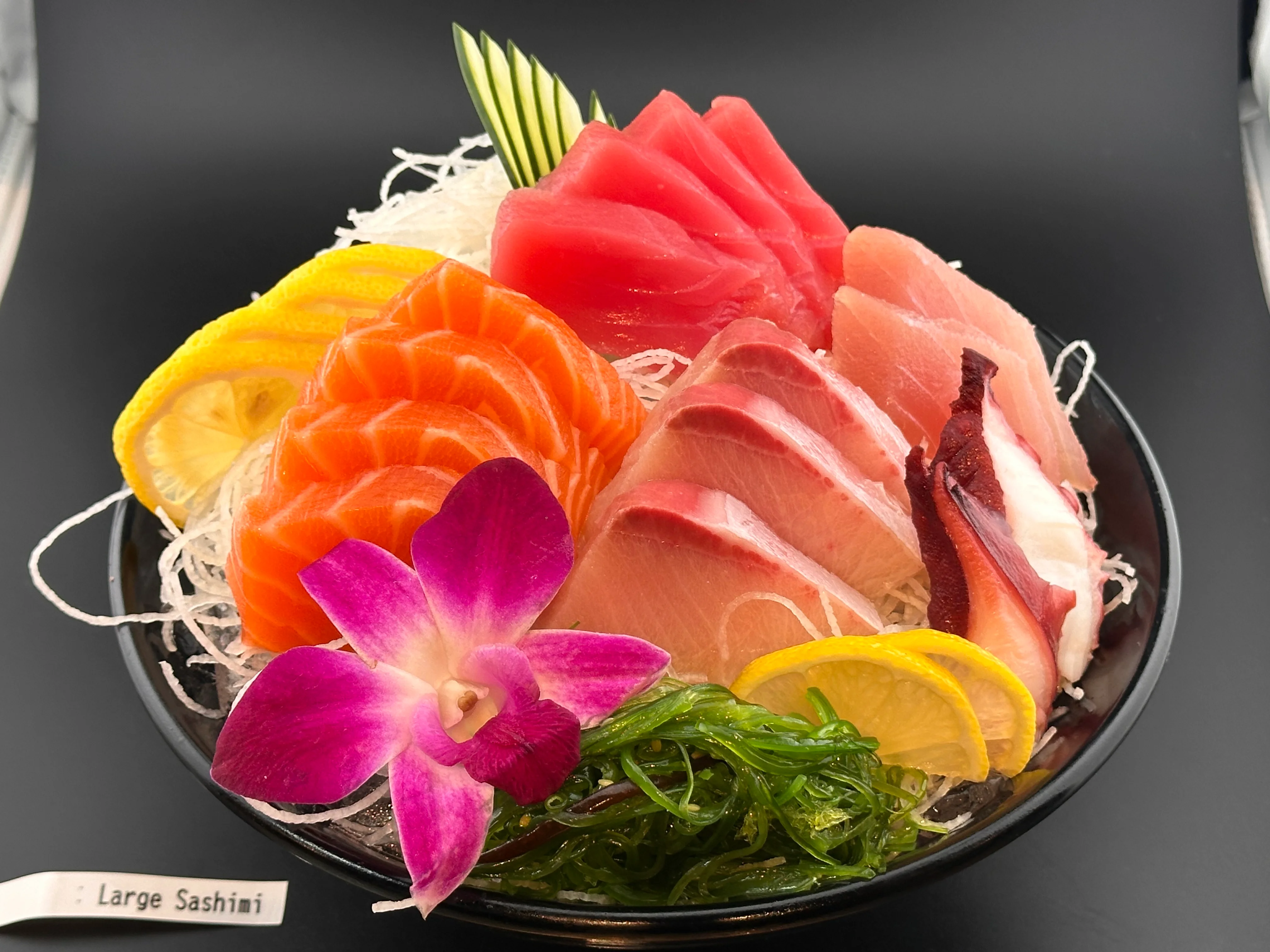 Japanese sashimi platter with assorted fresh fish and garnishes