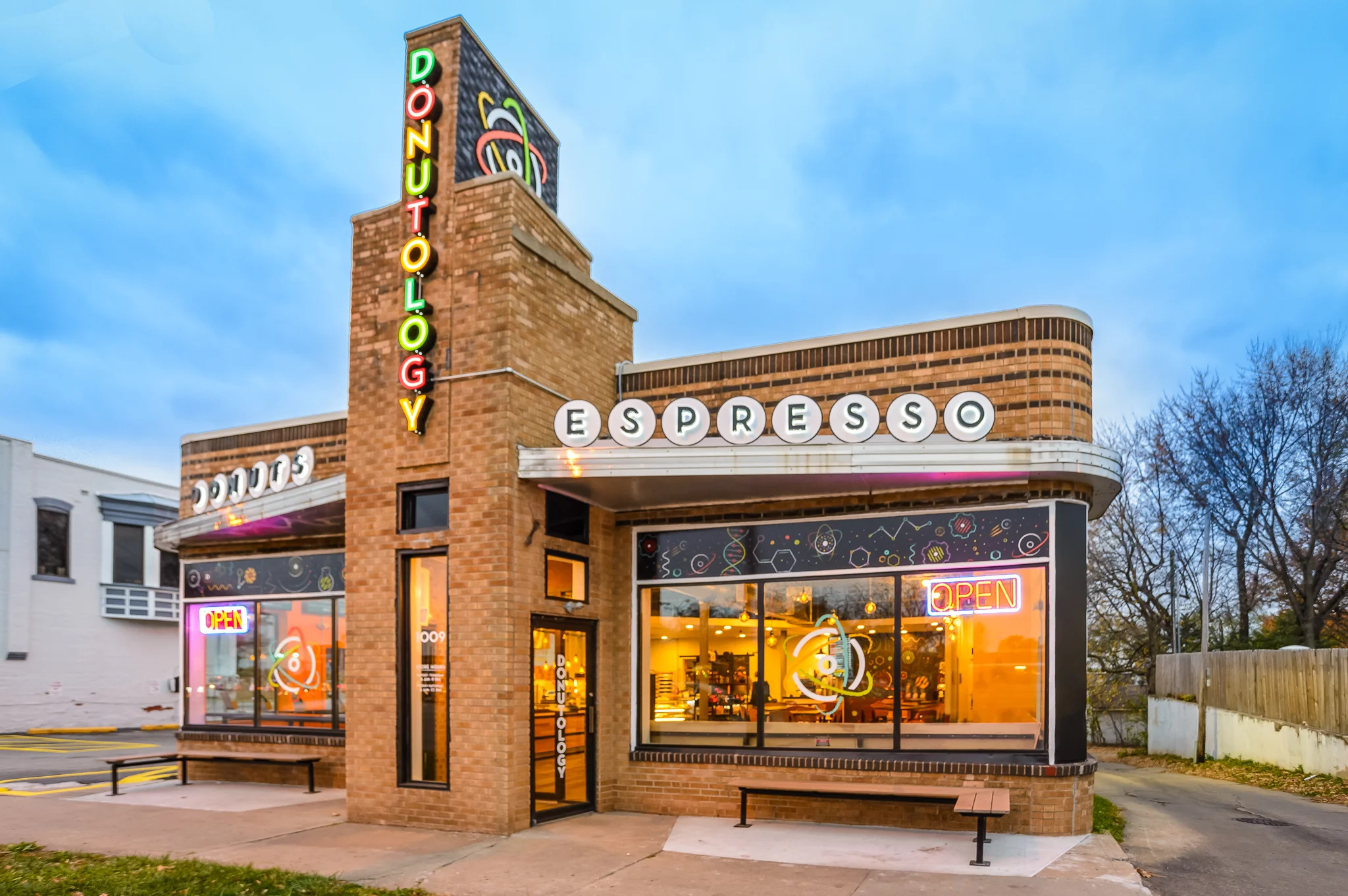 Colorful donut shop exterior with neon signs
