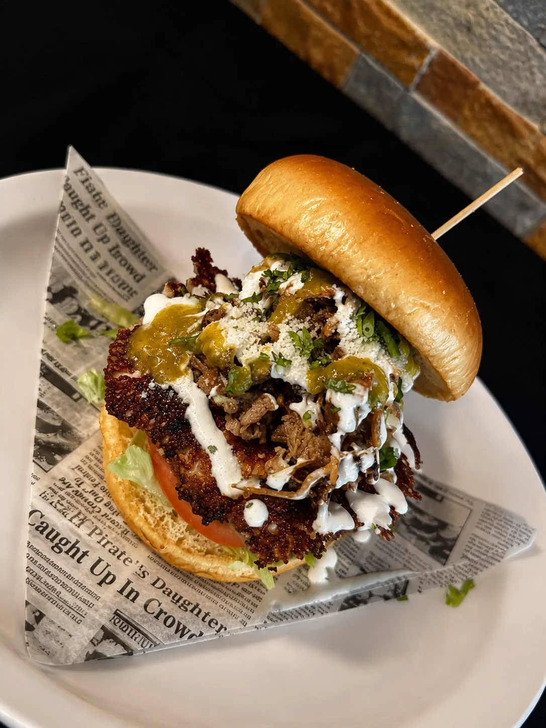 Crispy fried chicken sandwich with toppings