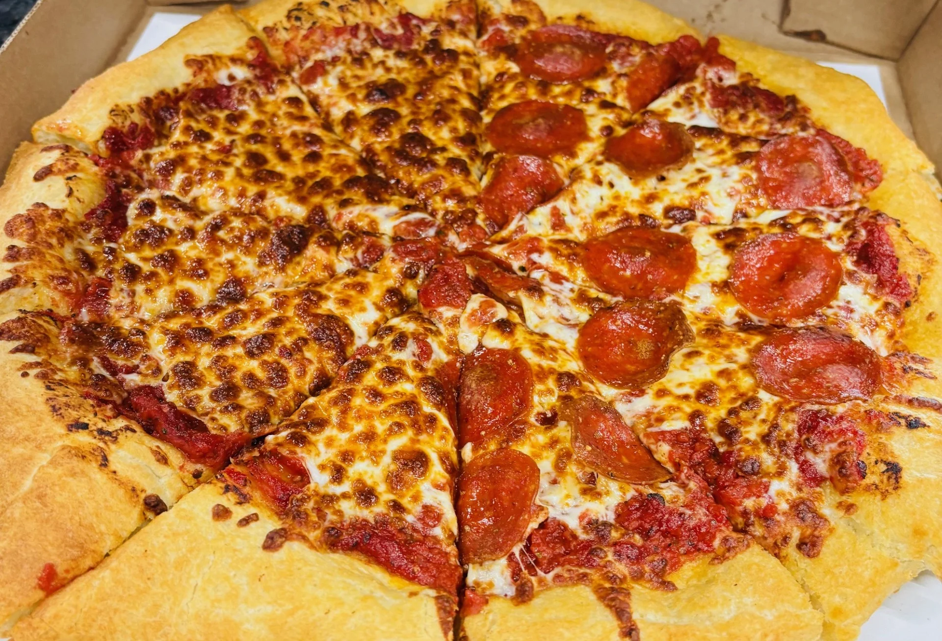 Pepperoni pizza in a cardboard box