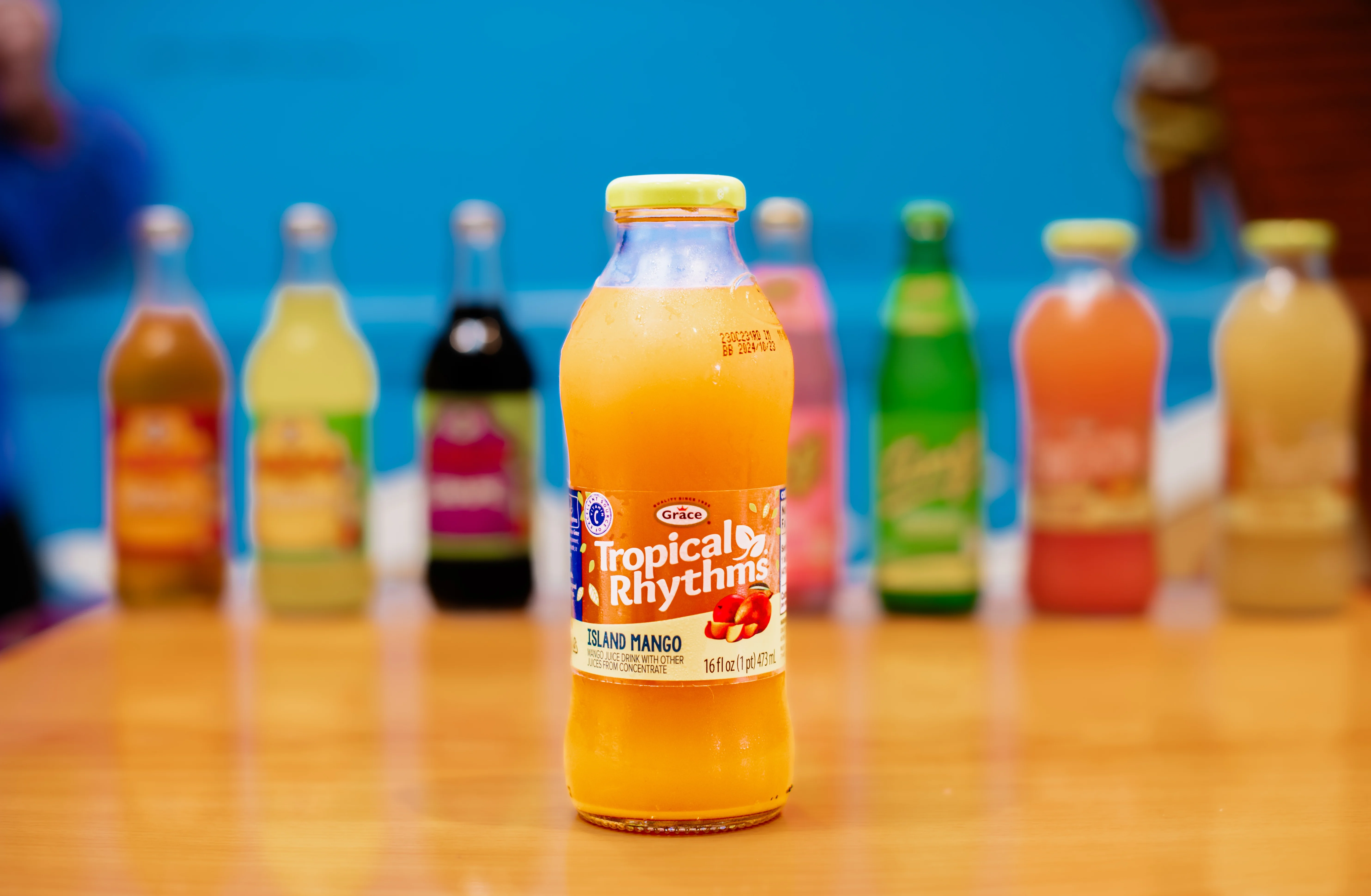 Tropical Rhythms Island Mango drink on a wooden table